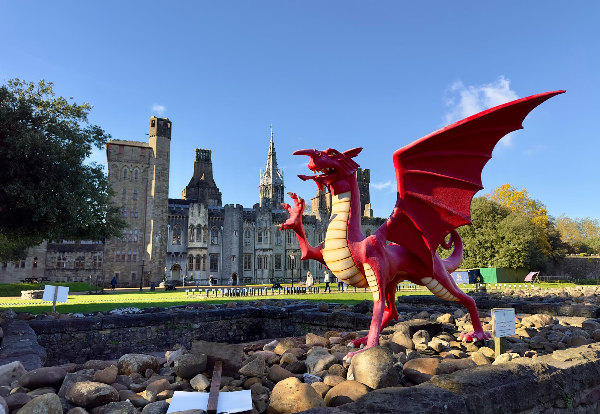 A red dragon in front of the Cardiff Castle