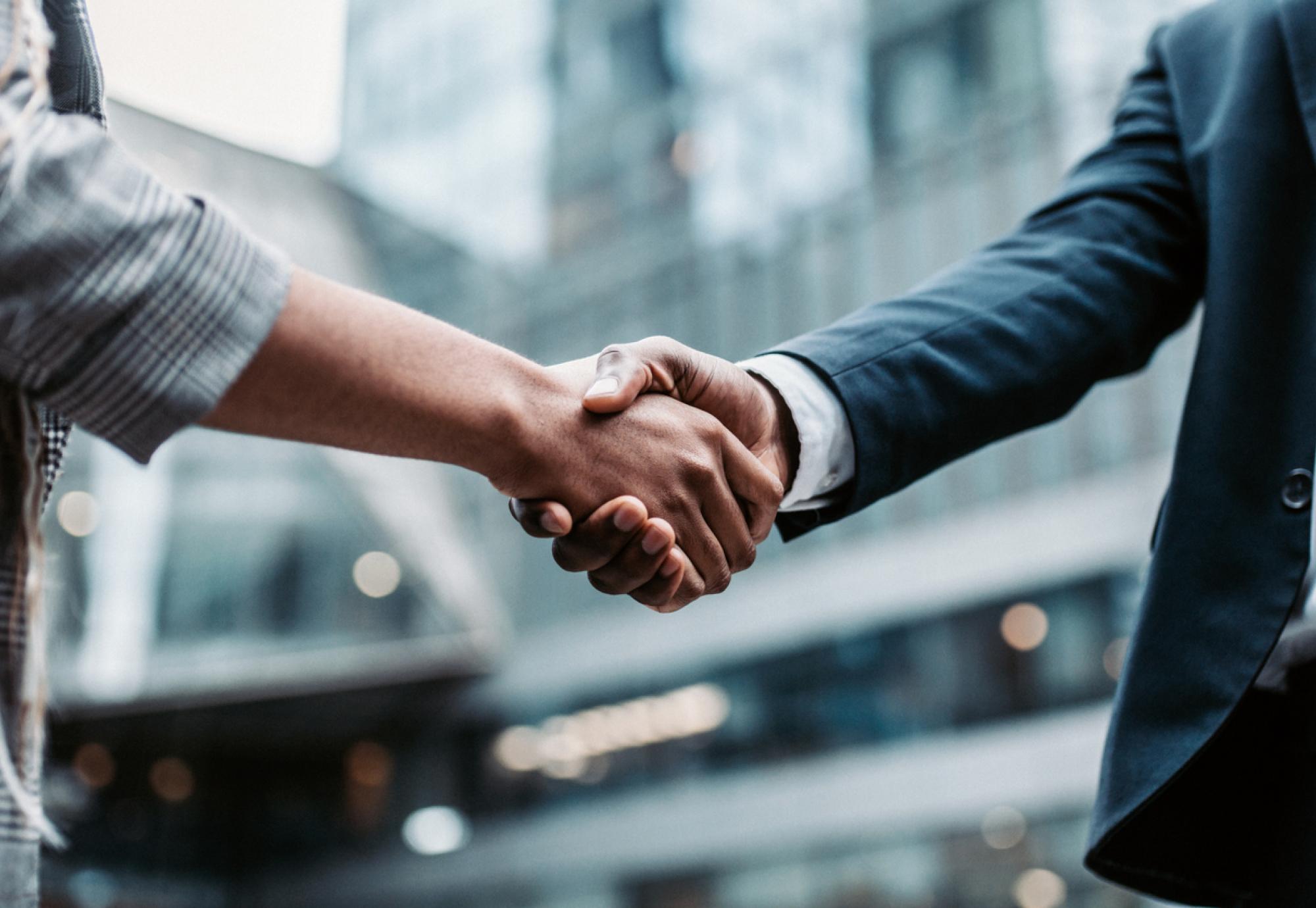 Two people shaking hands after meeting