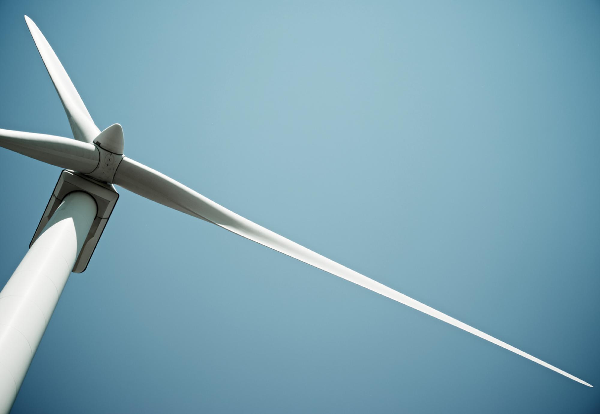 Wind turbine with the blue sky in the background