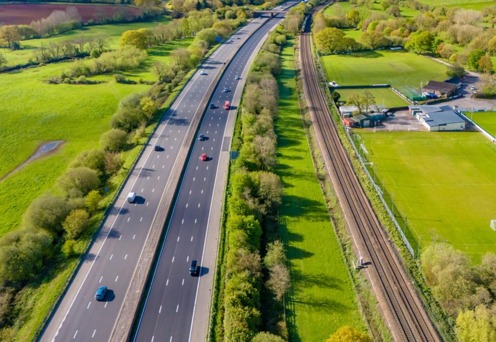 Aerial shot of the M5 motorway and a railway line