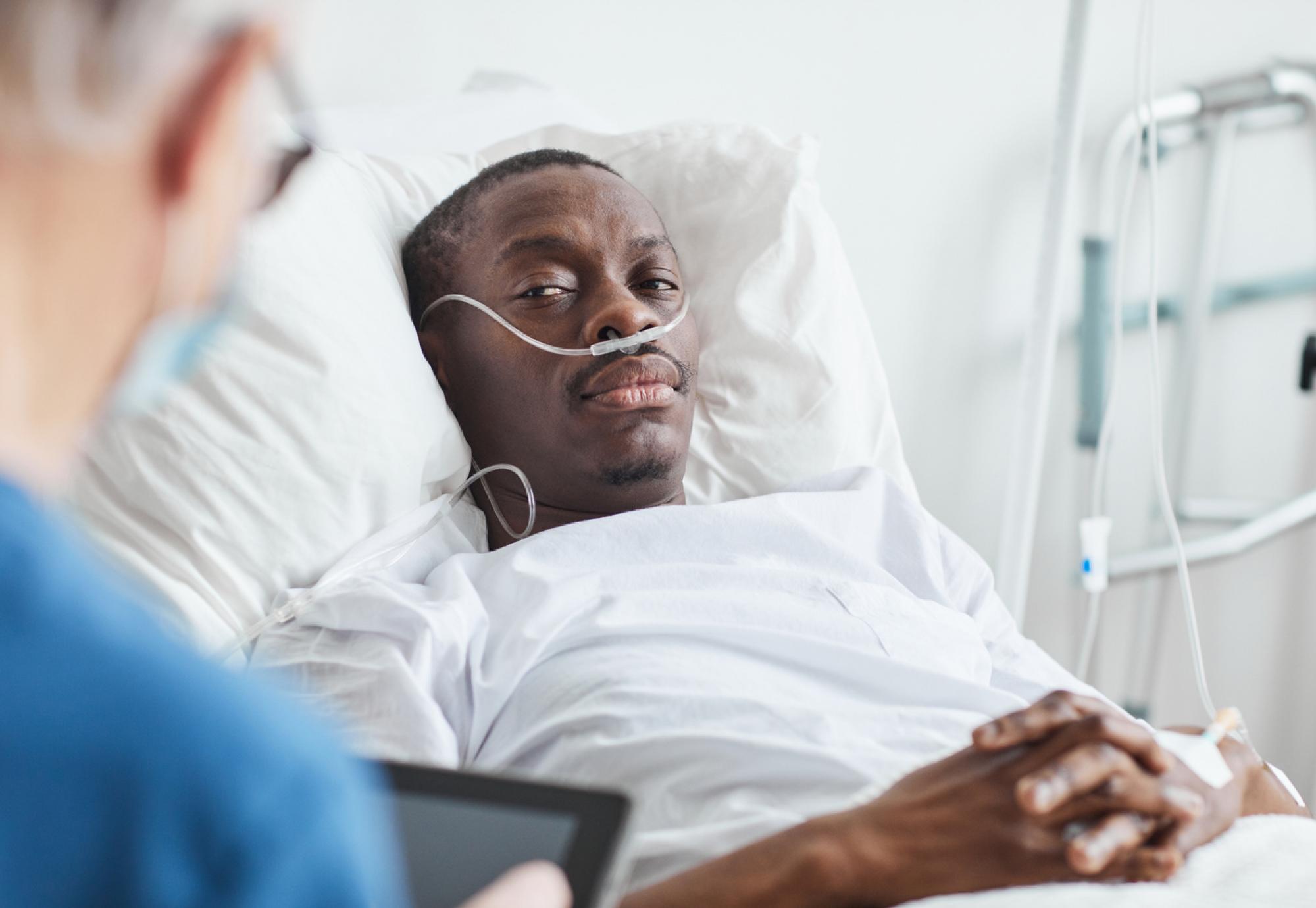 Man laying in a hospital bed