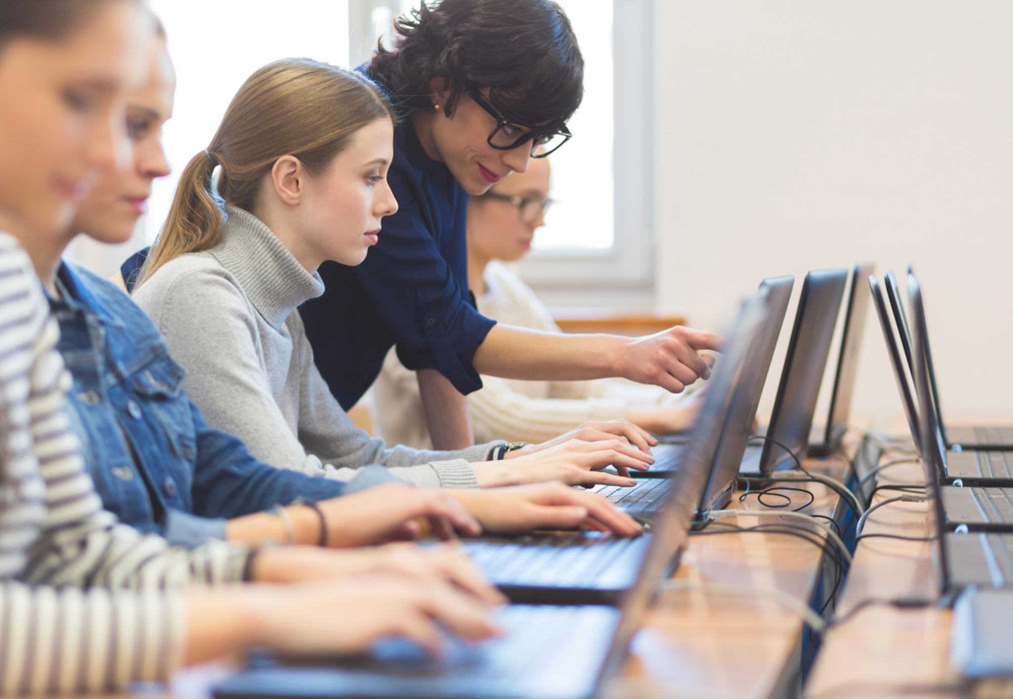 Young female student learning digital skills