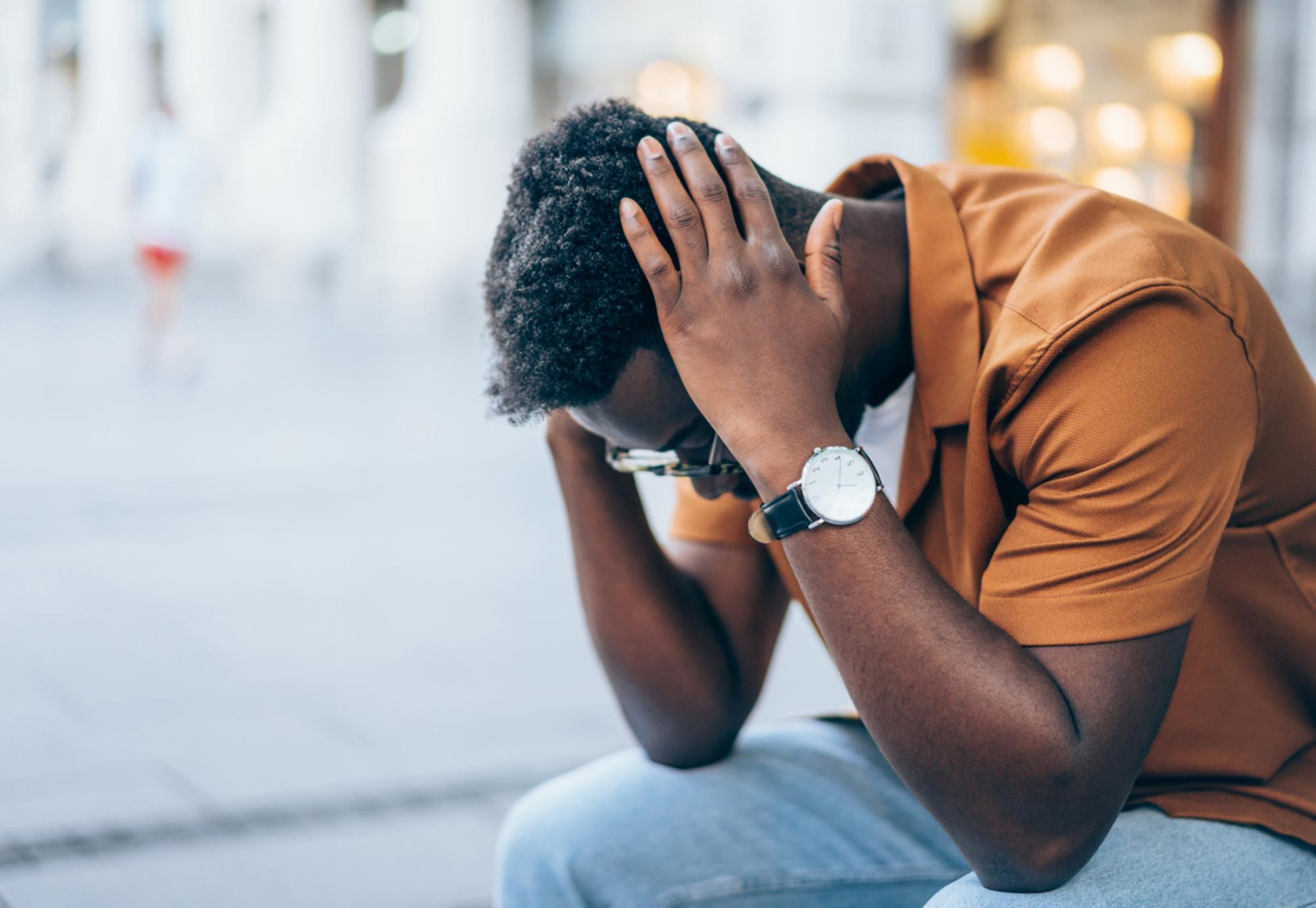 Young man contemplating suicide