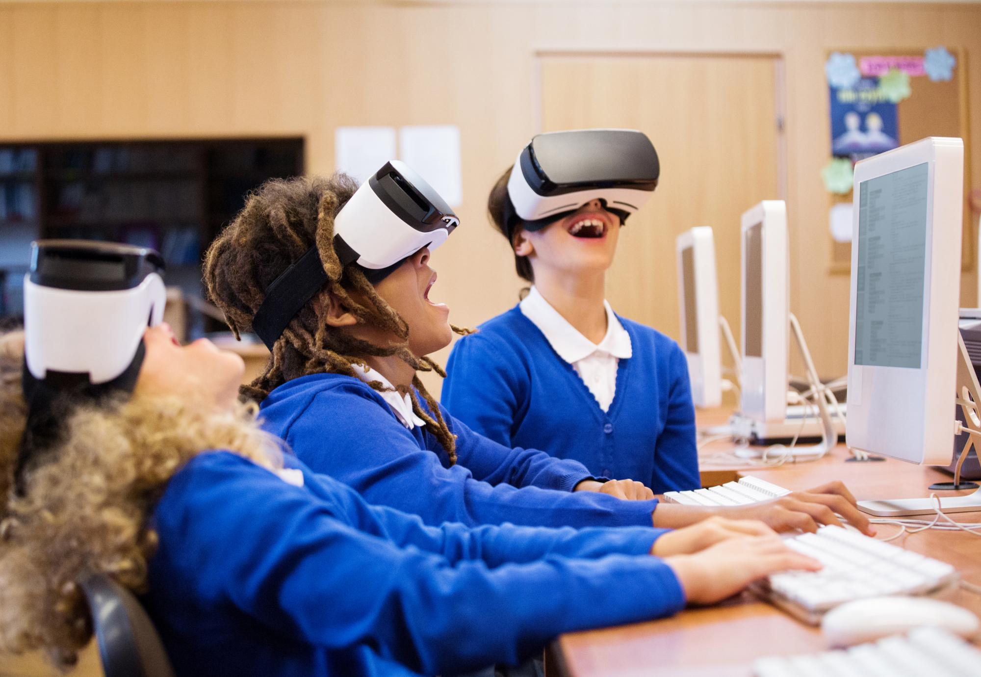 group of students using virtual reality goggles