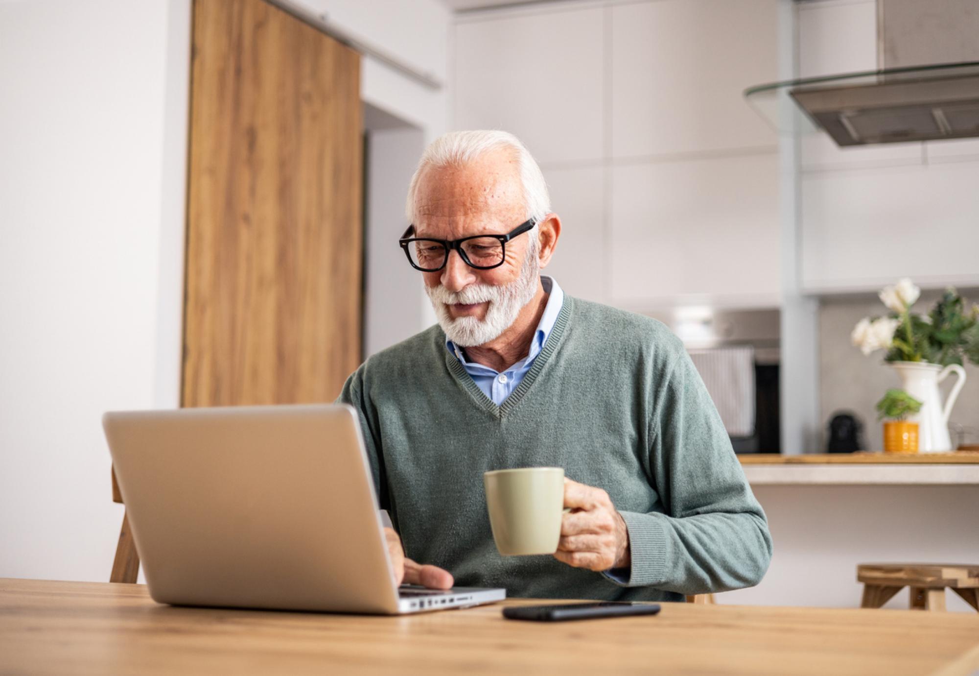 Pensioner using a laptop