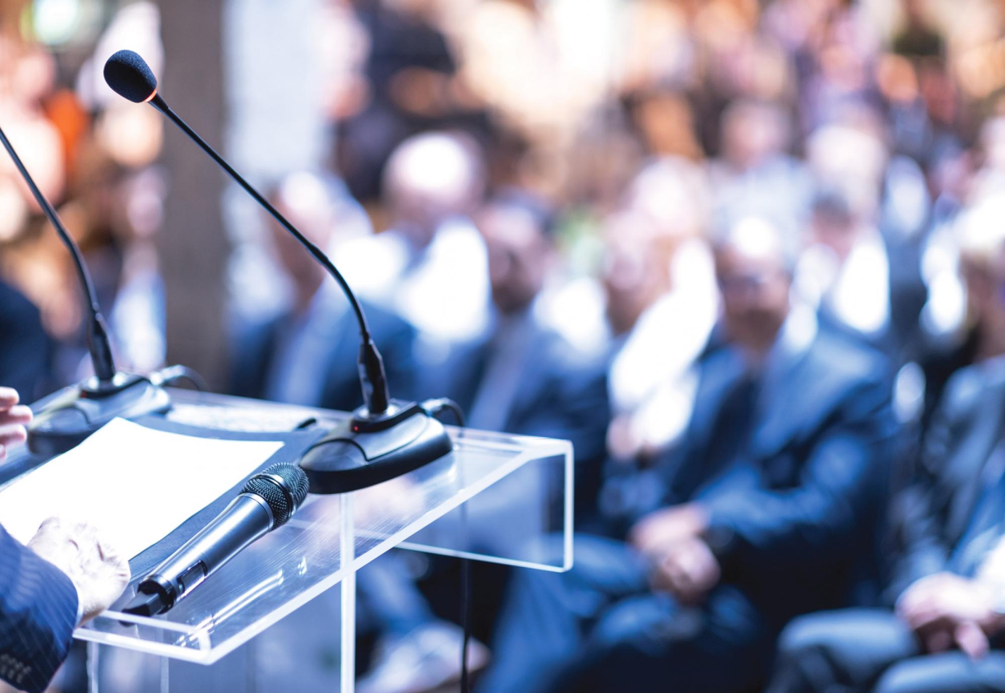 Person speaking at an awards ceremony
