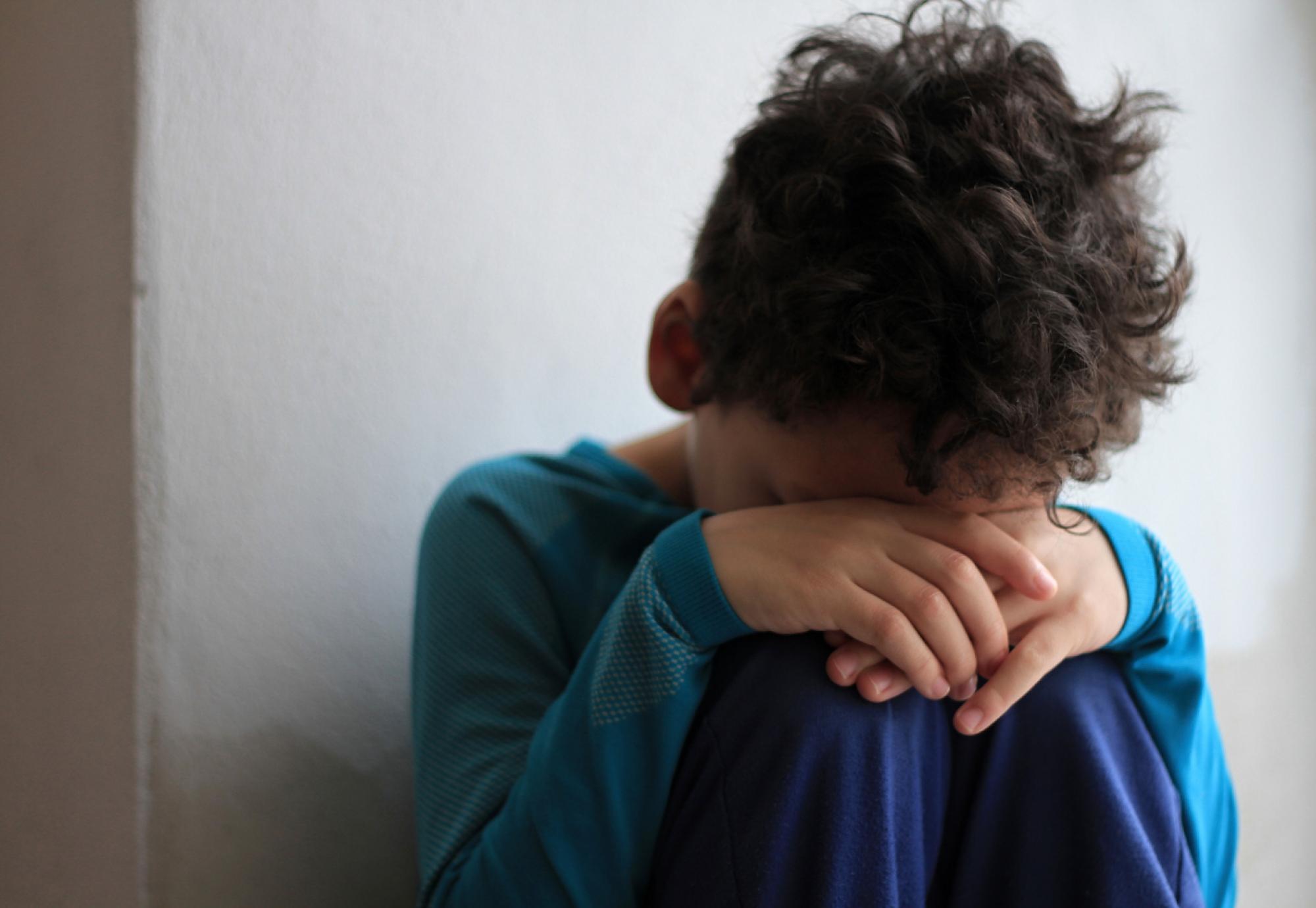 An upset child in poverty