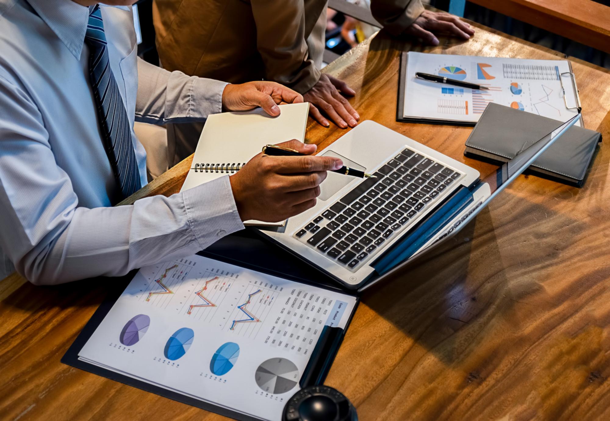 Businessman inspects financial reports