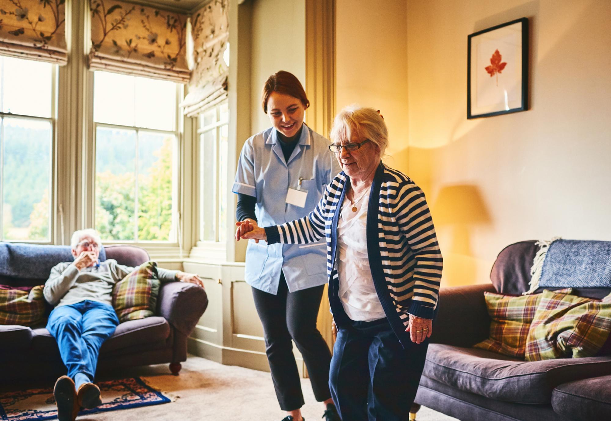 Nurse supporting woman with care needs