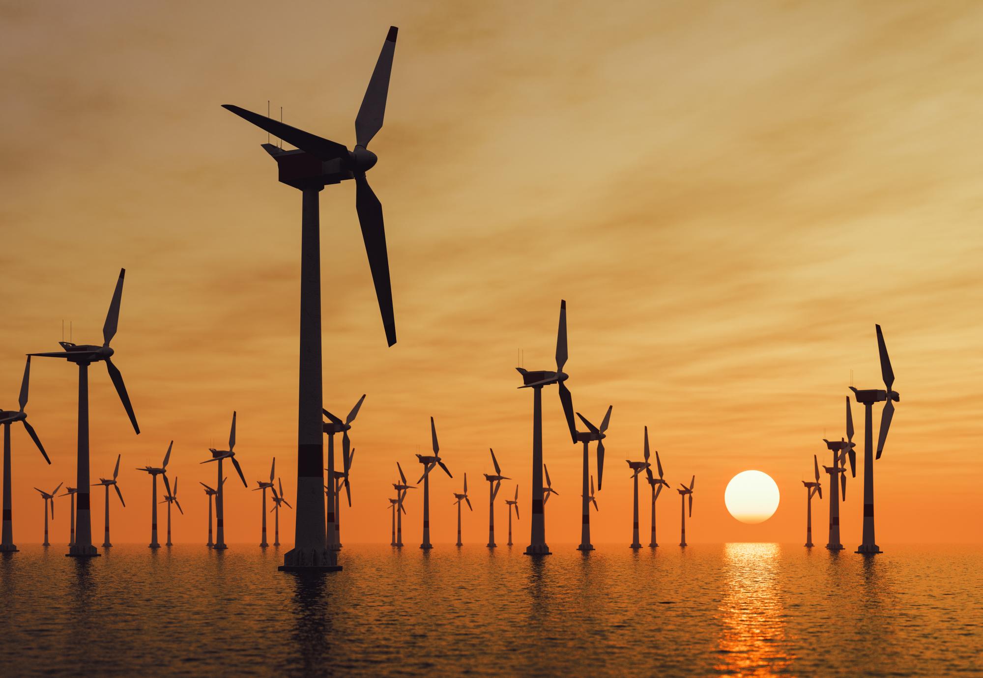 Offshore wind turbines at sunset