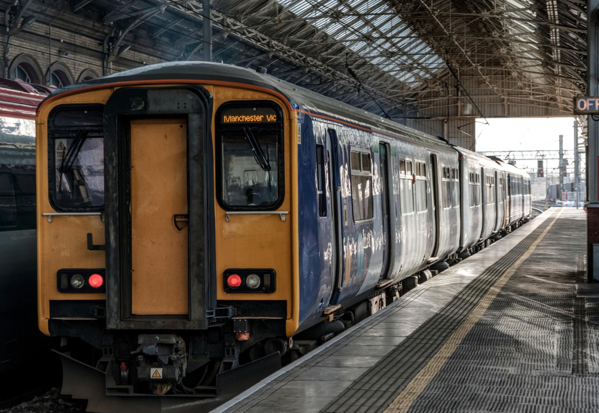 Train from Northern leaves the station on way to Manchester