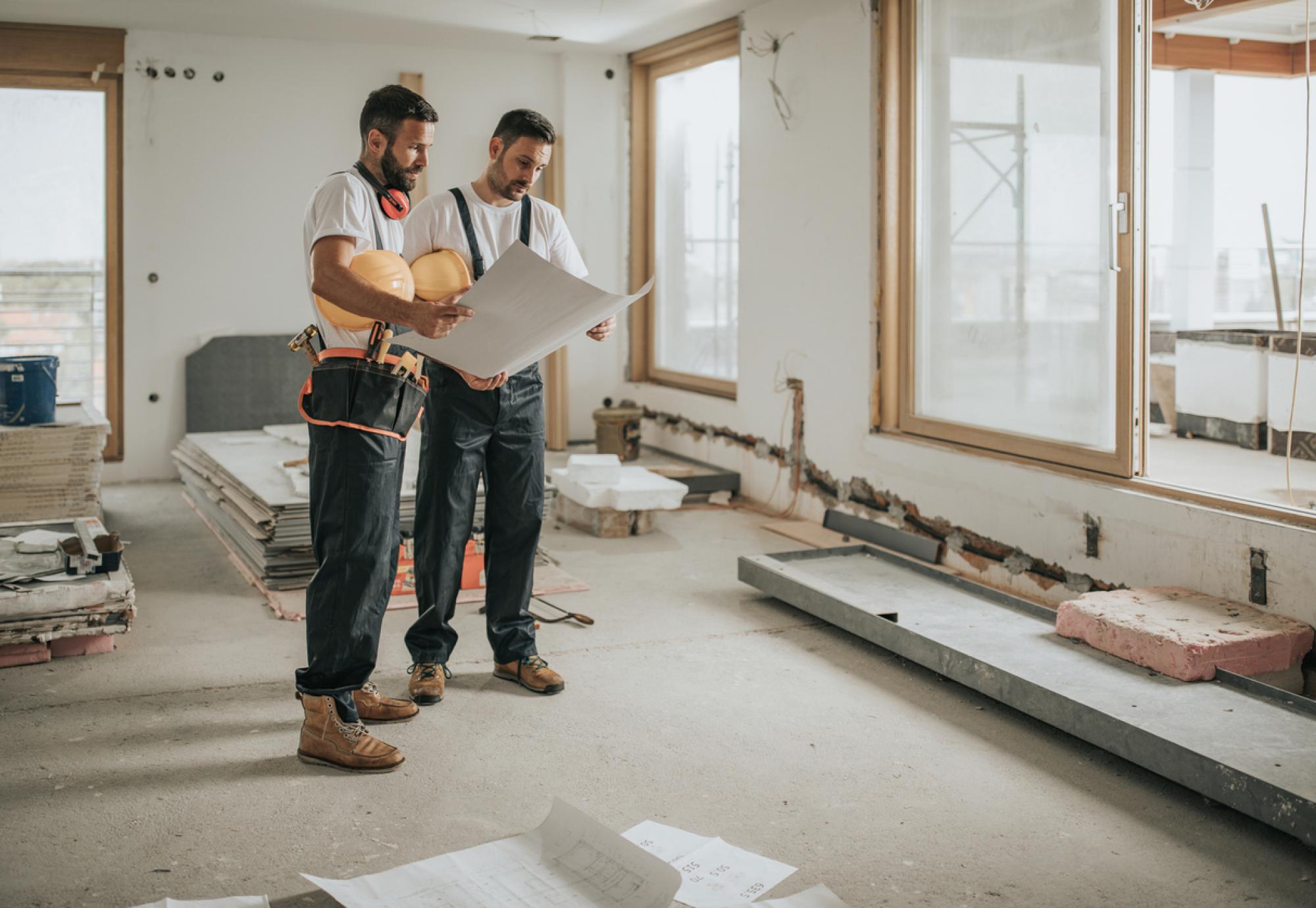 Two builders working on a new house