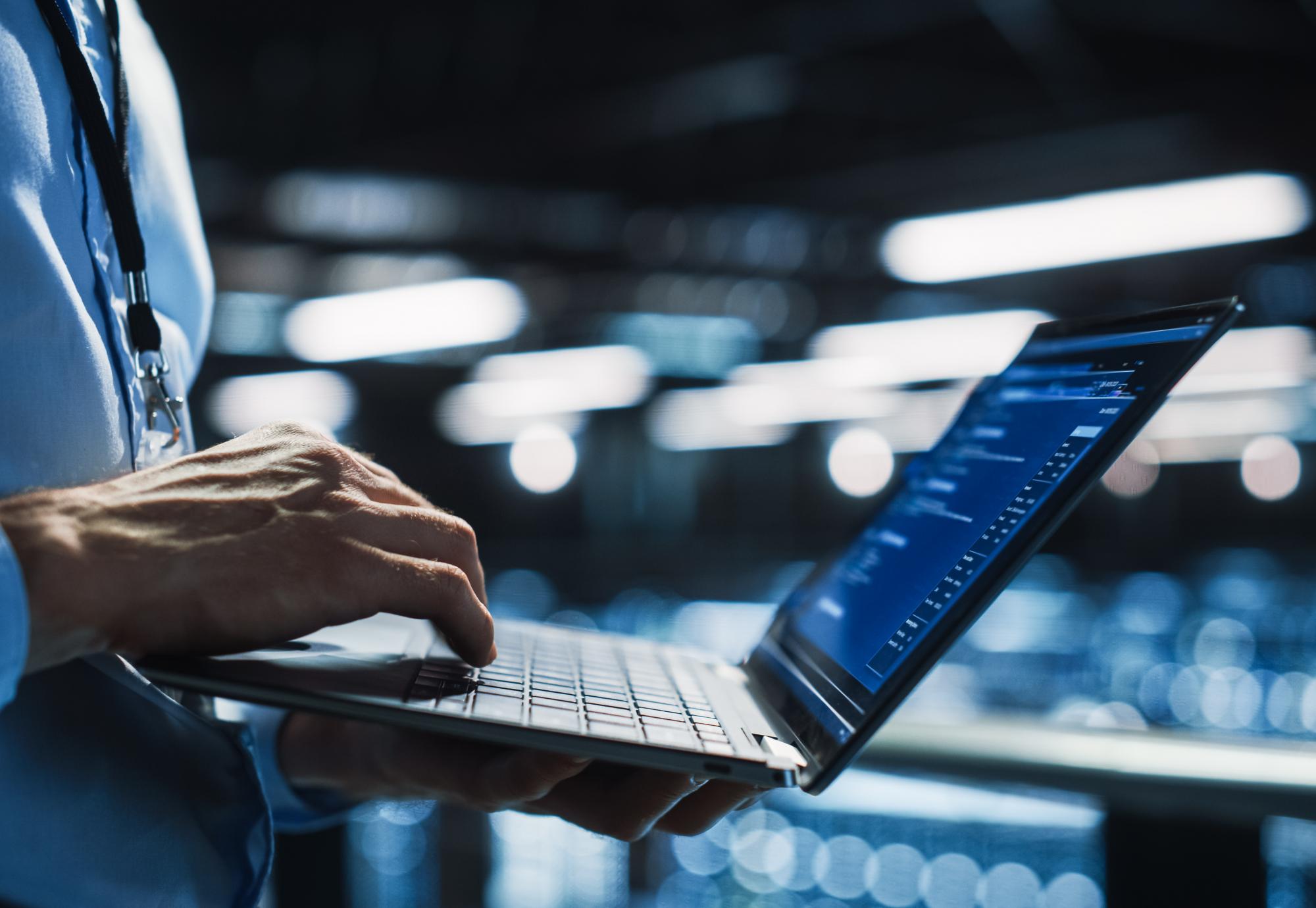 Quantum technology expert using laptop