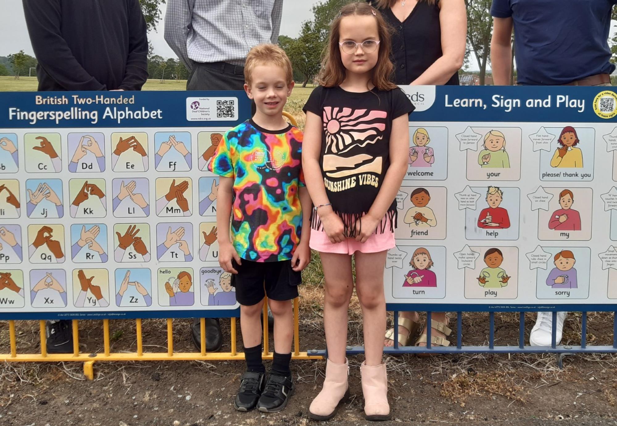 Kids with sign language signs 