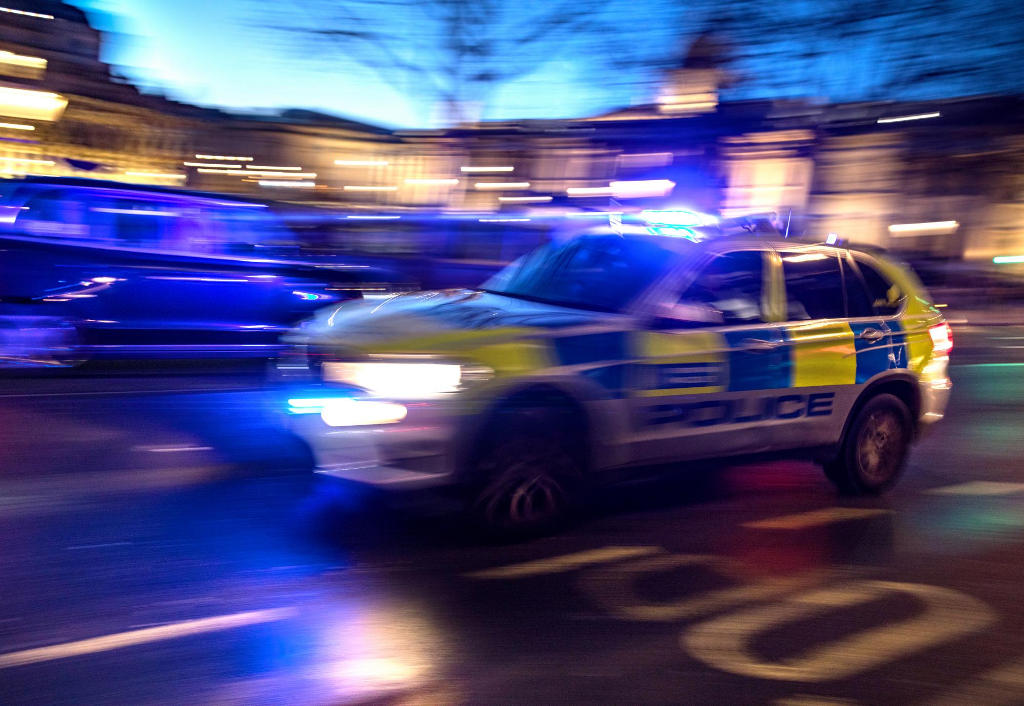 Police car responding to crime in London