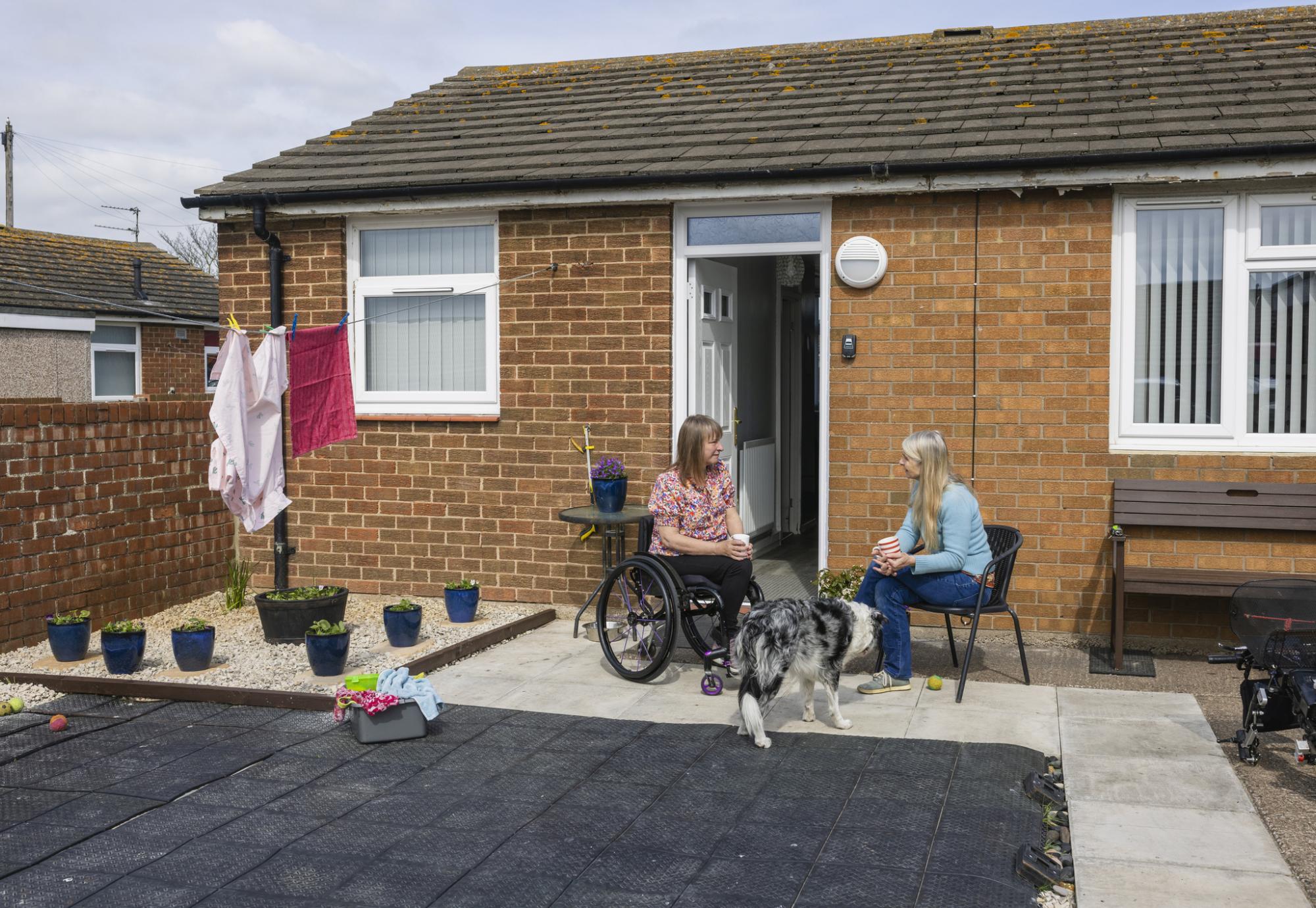 Two women catching up at supported housing