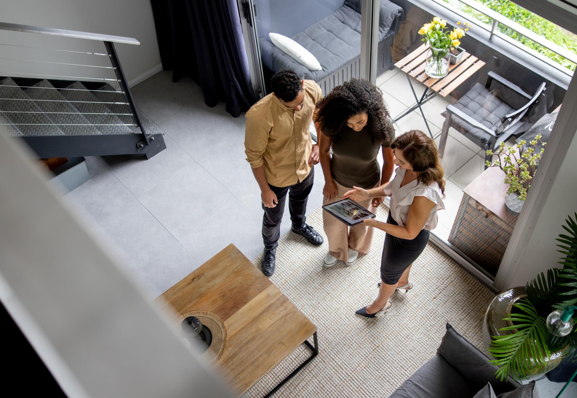 Couple talking to a landlord