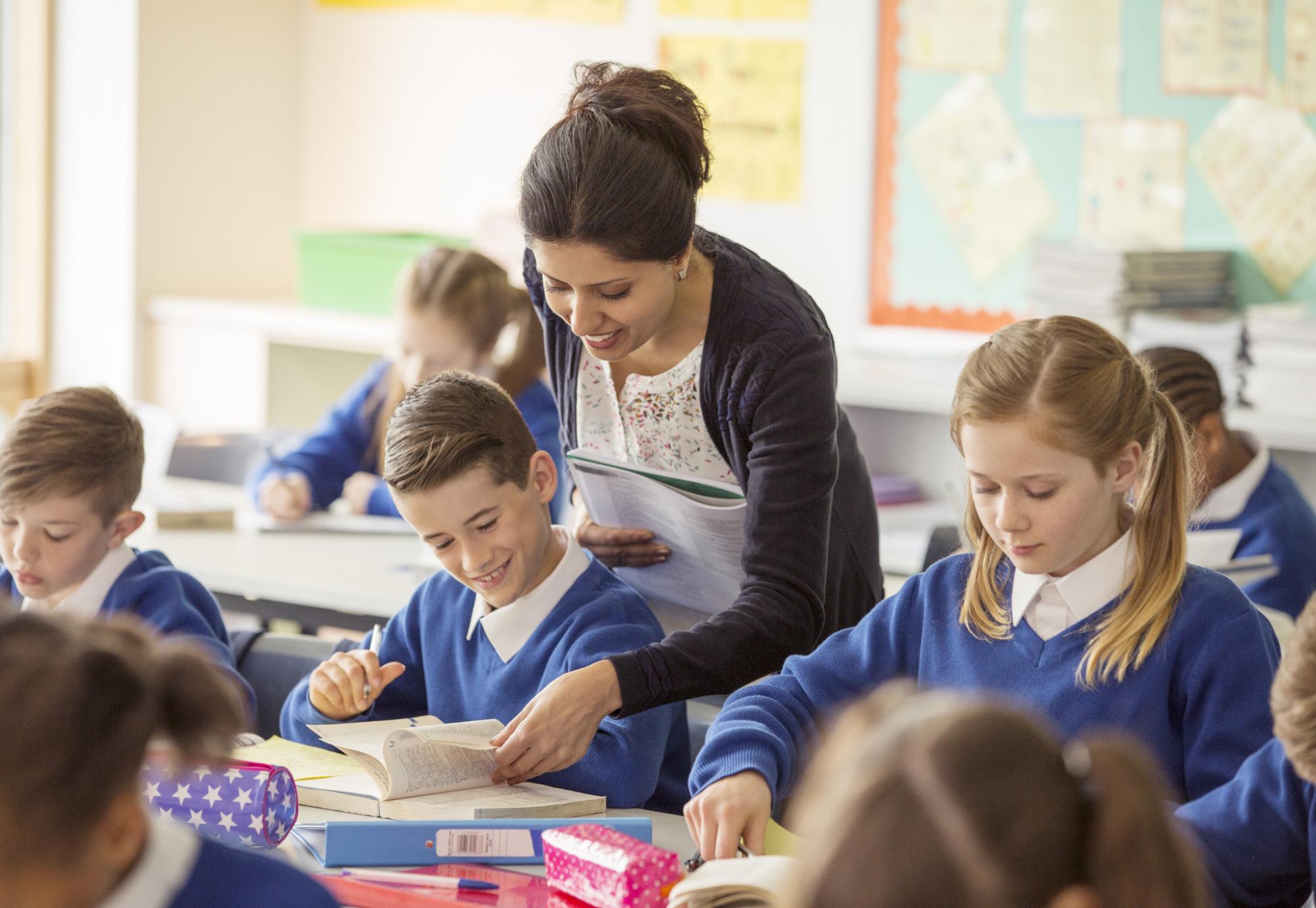 Female teacher with her pupils