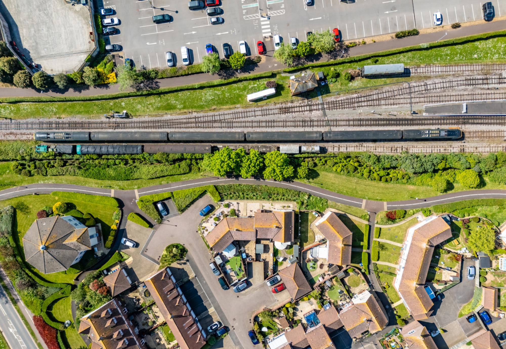 View of houses next to a train station