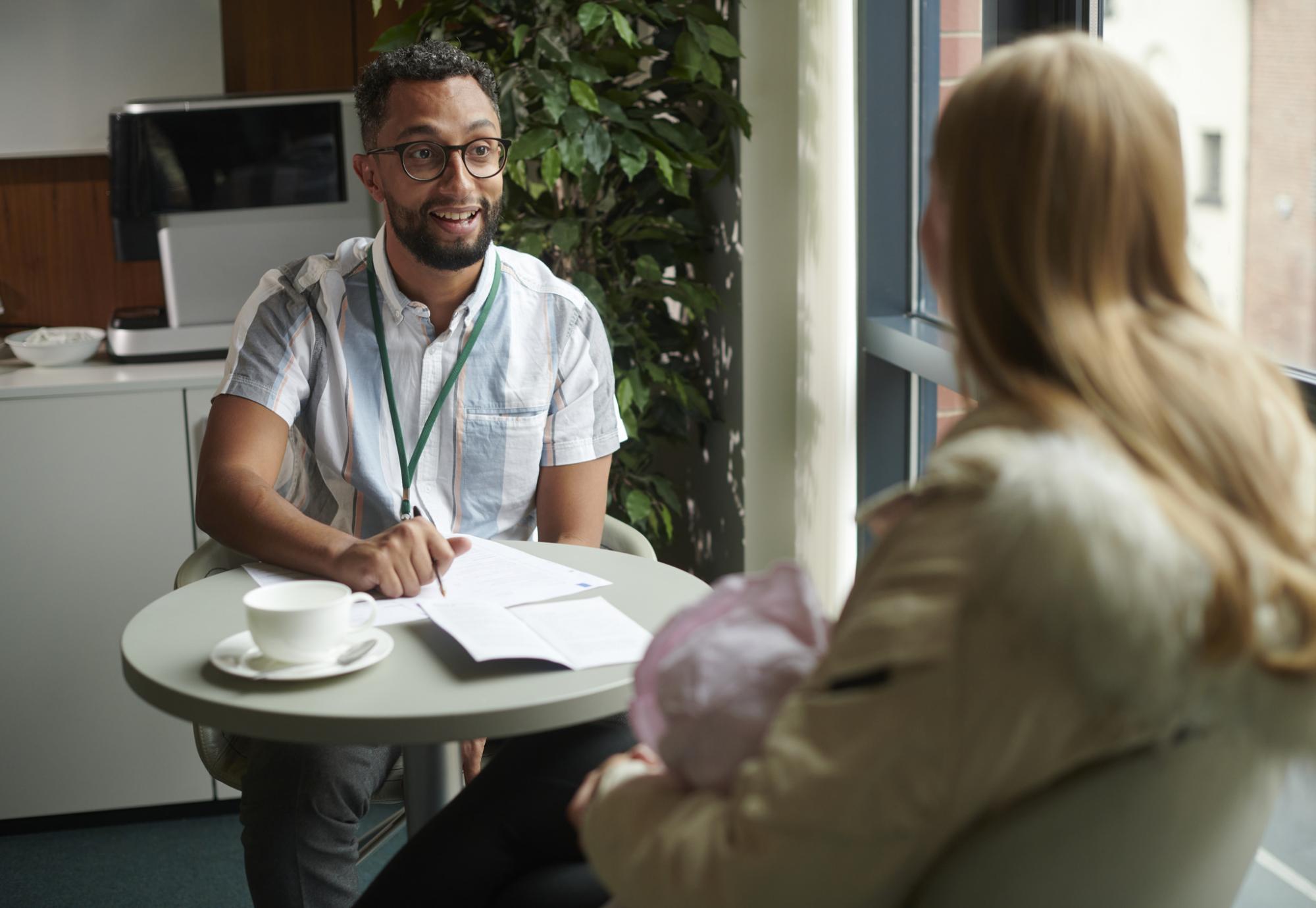 Young woman with social worker