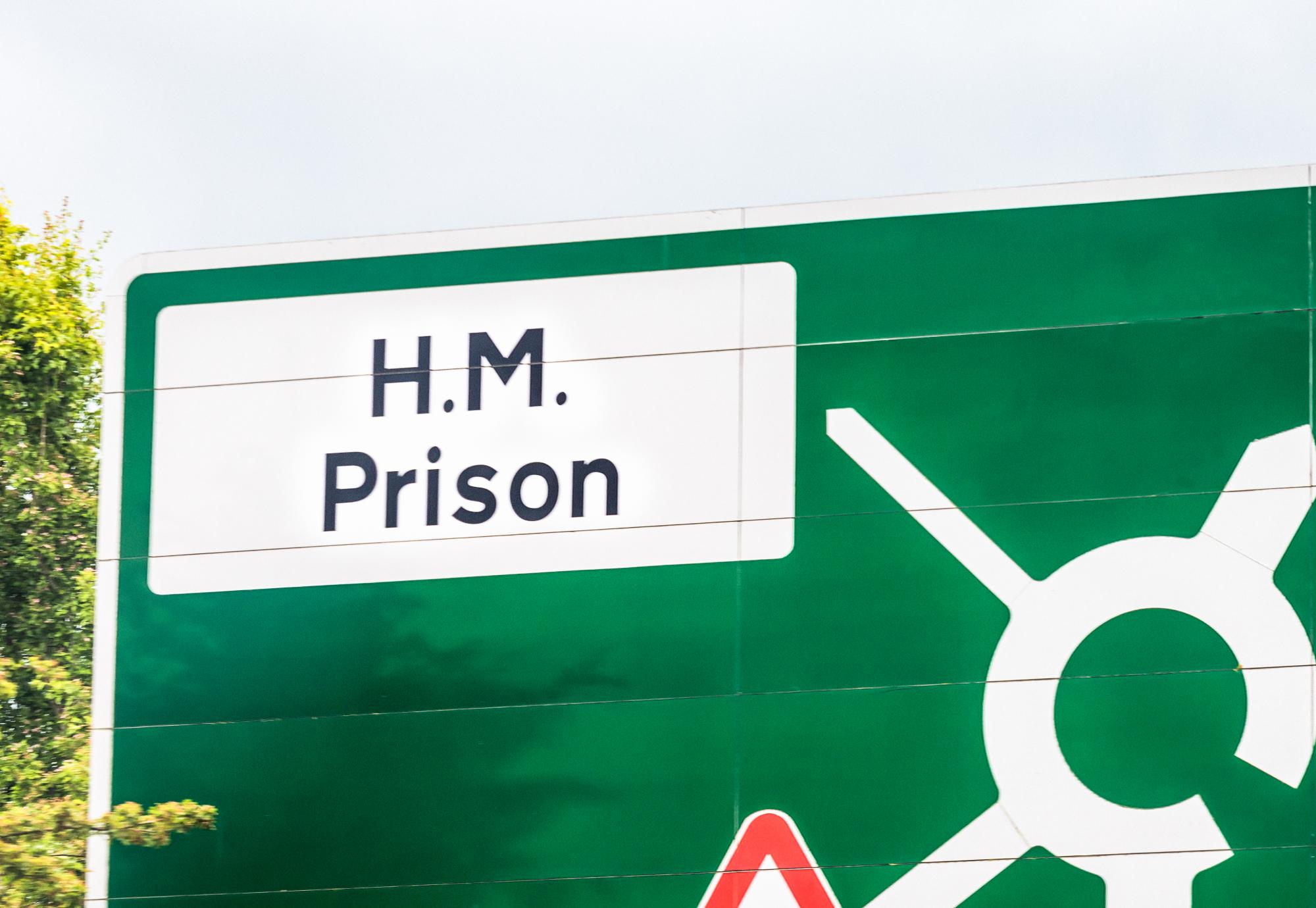 HM Prison road sign