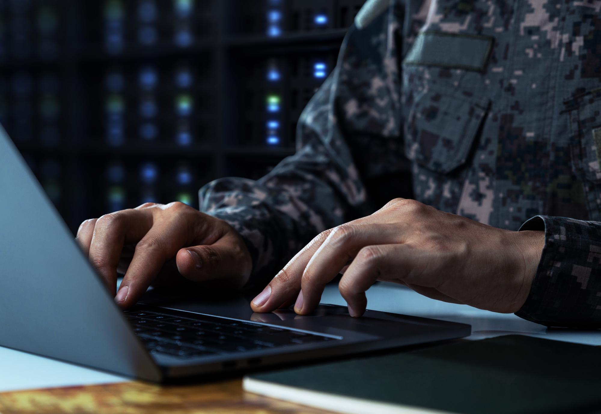 Soldier working on computer