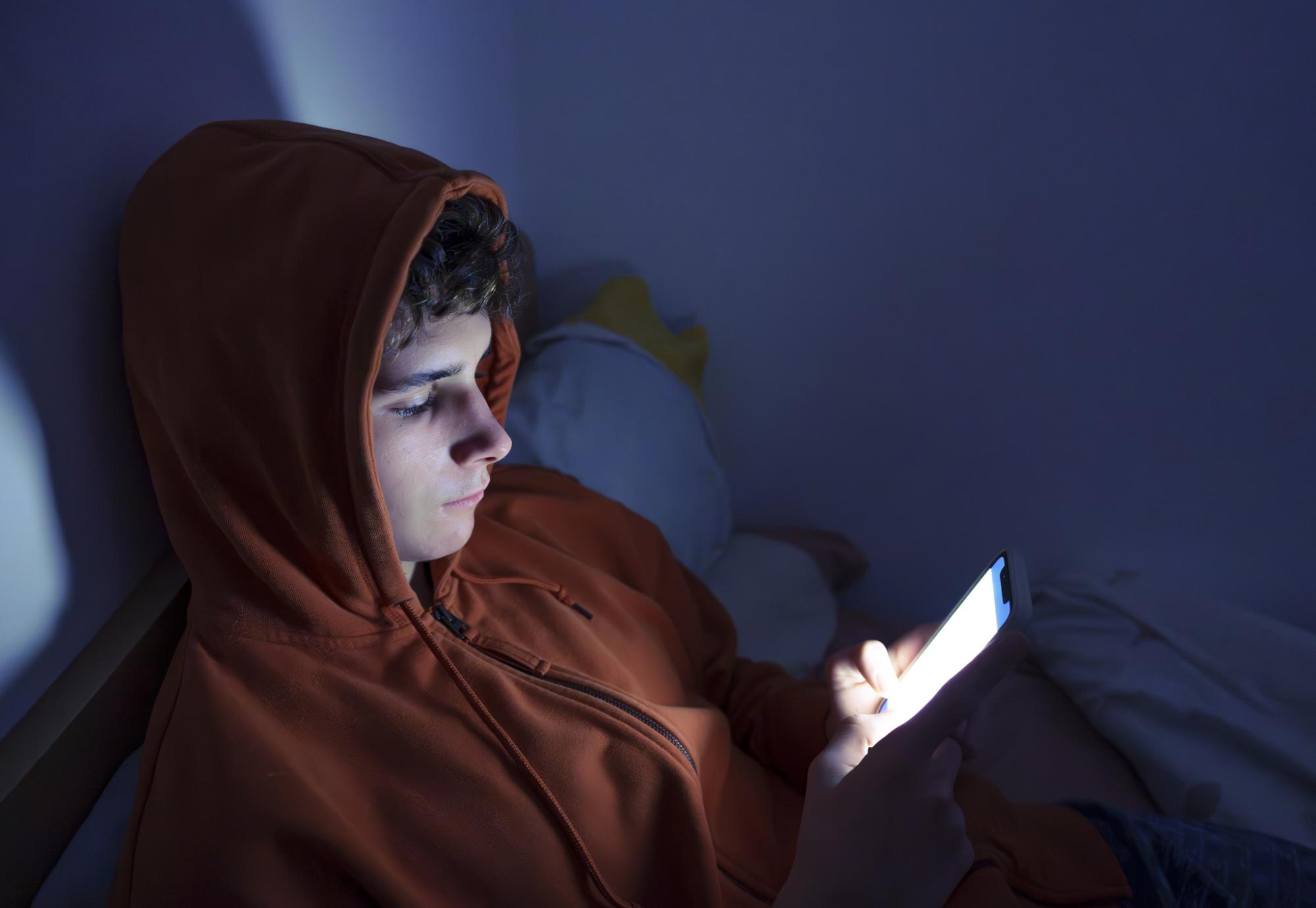 Teenager using a smartphone