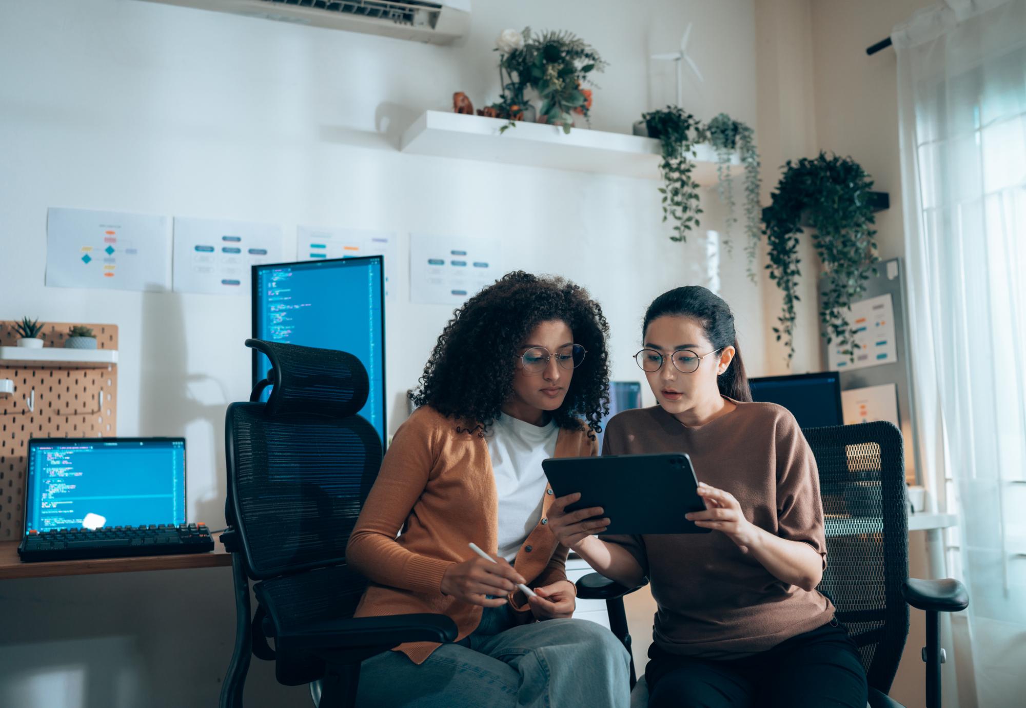 Two women working on computers