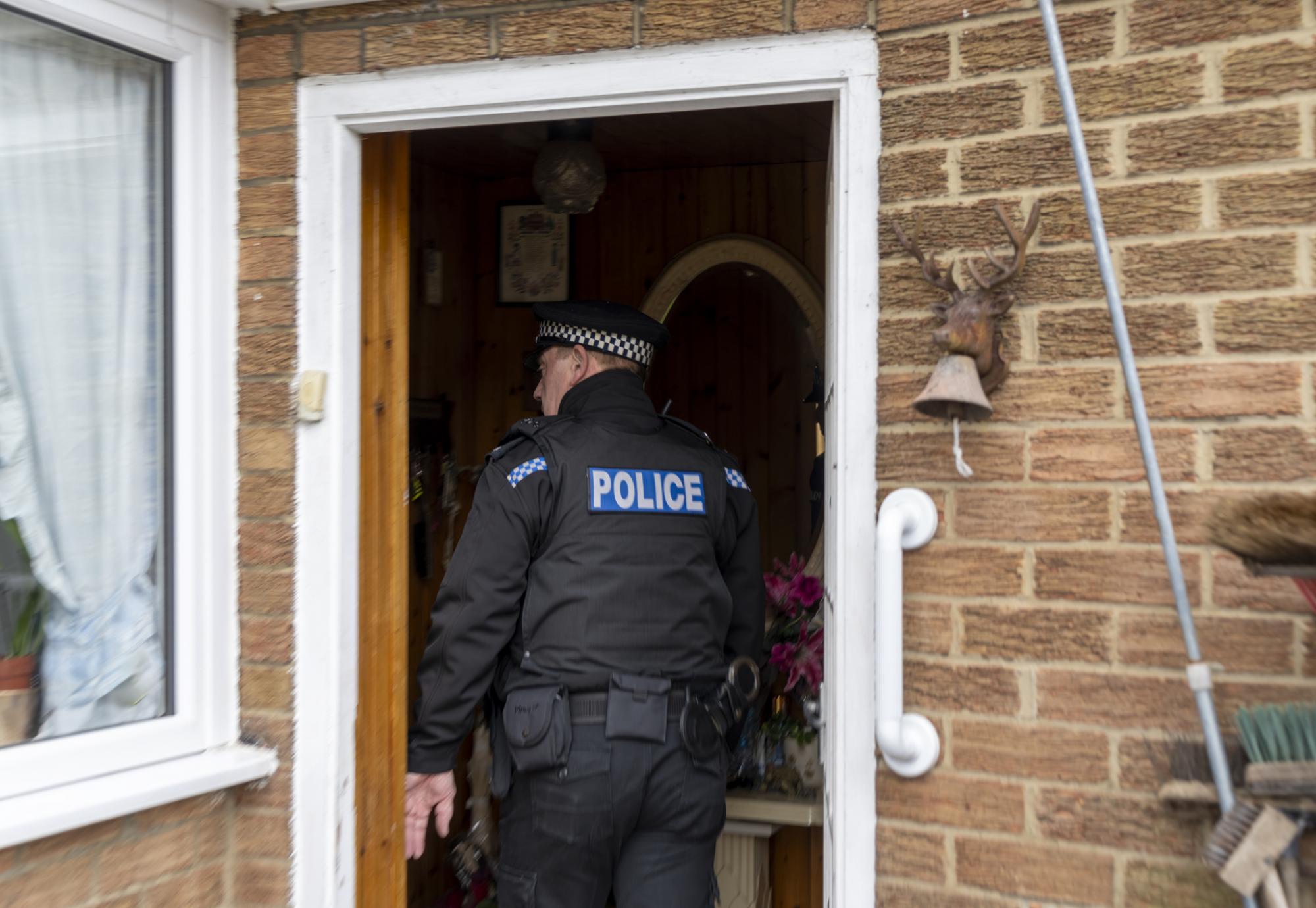 Police Officer entering someone's home