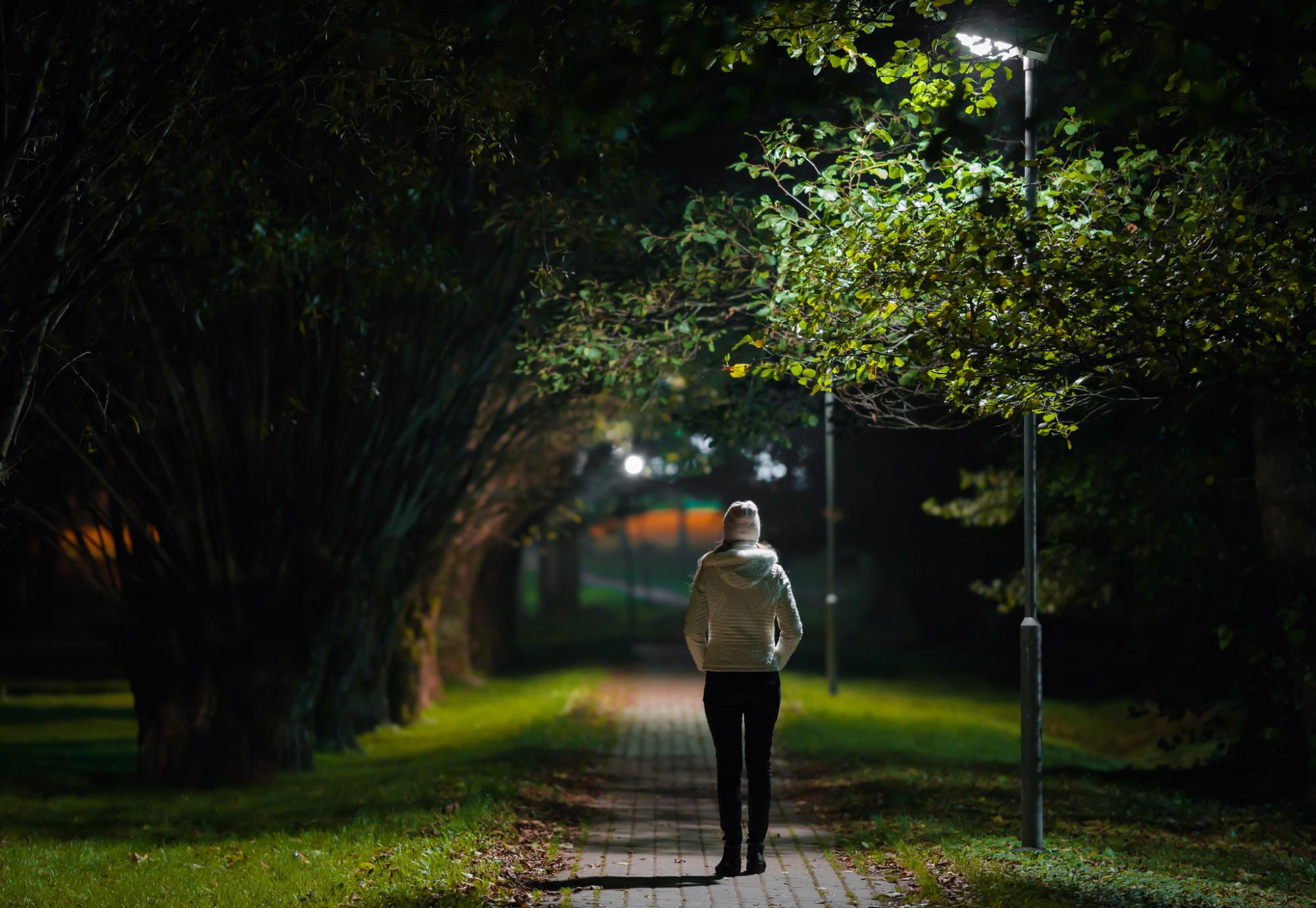Woman walking at night