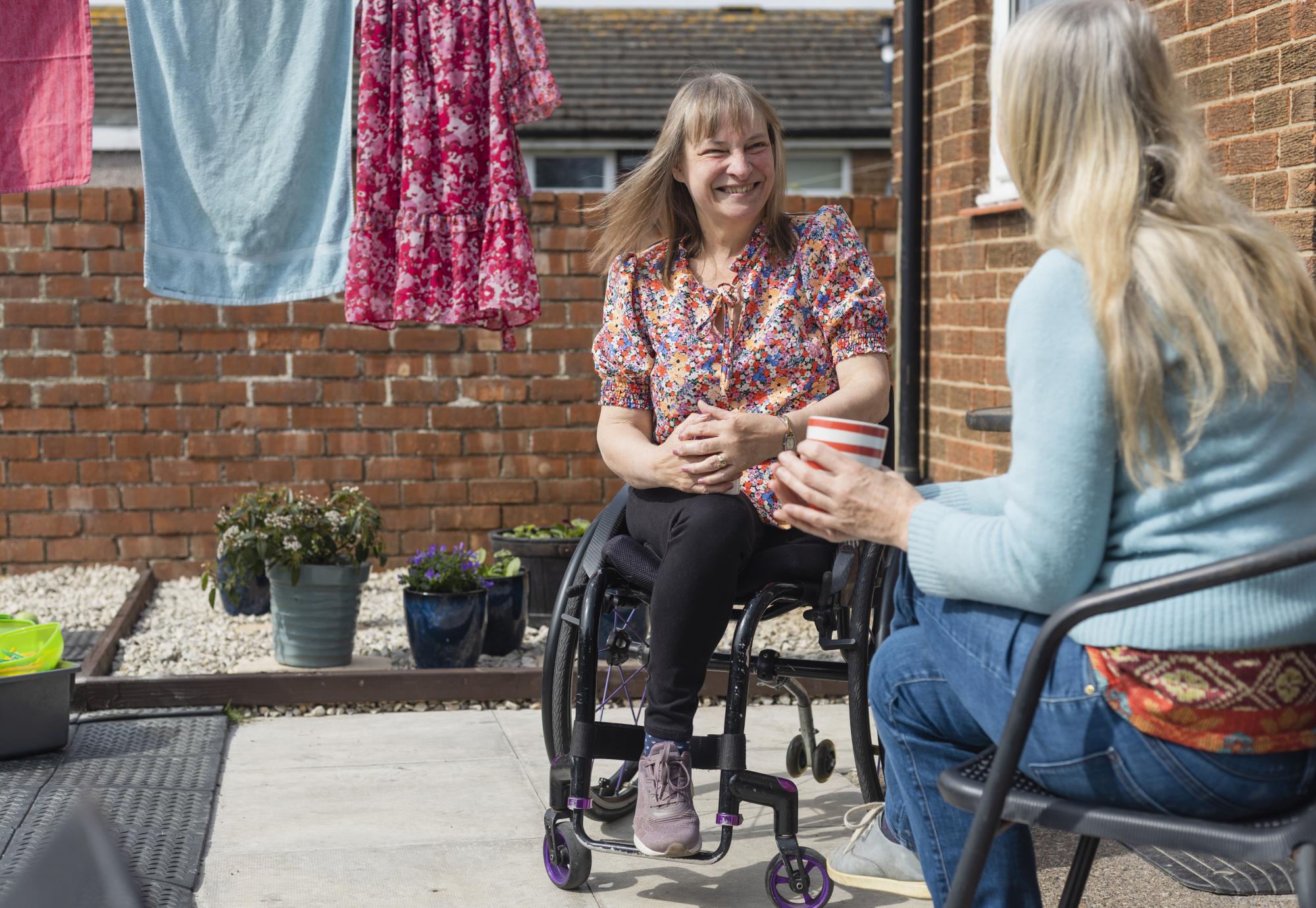 Woman in a wheelchair at home
