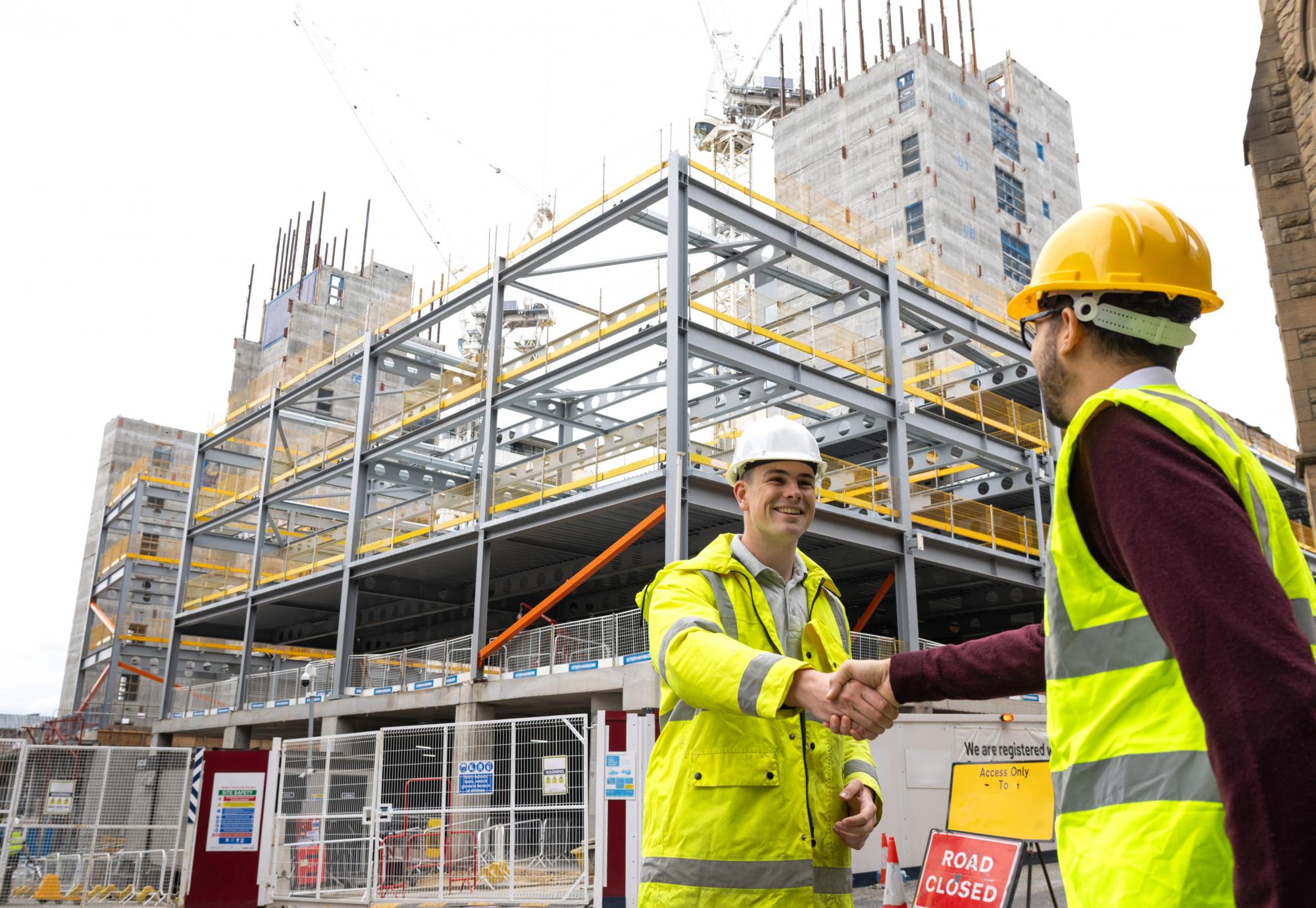 Men shaking hands at work