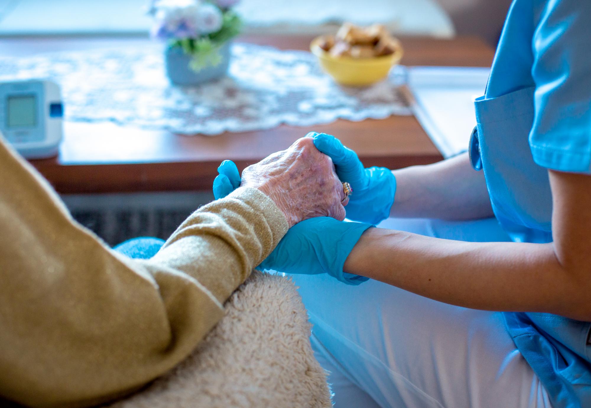 Social care worker with elderly patient