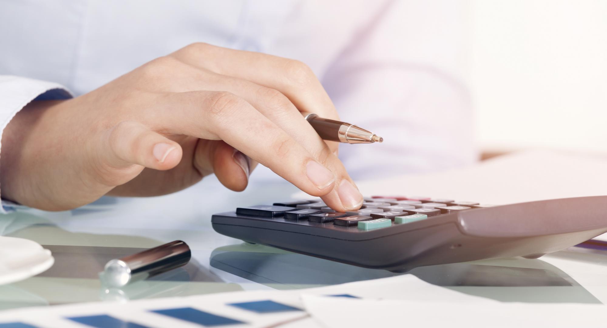 Businesswoman using calculator