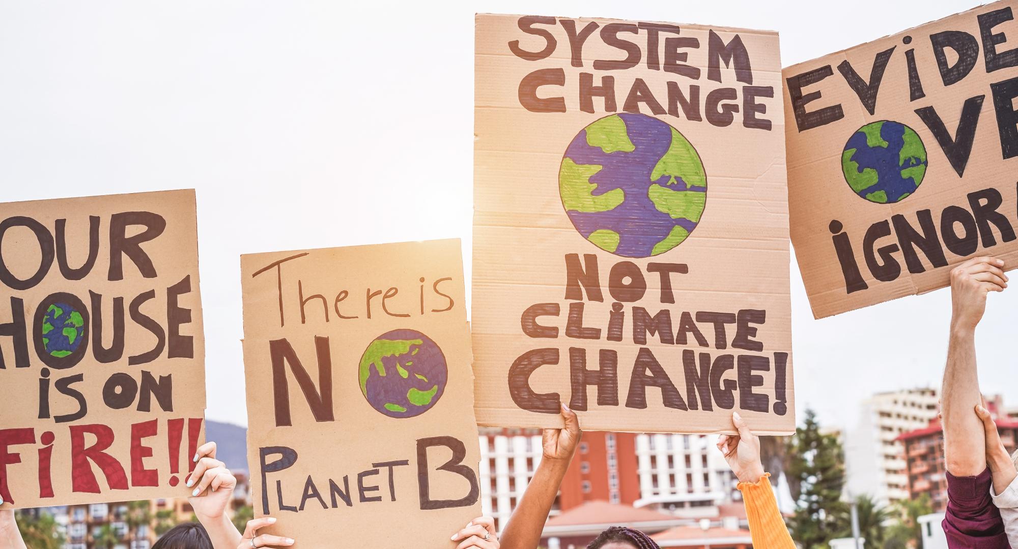 Group of demonstrators on road, young people from different culture and race fight for climate change.