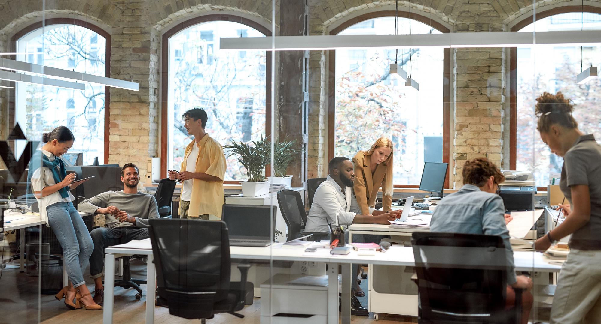 Group of mixed race business people working together in the creative office.