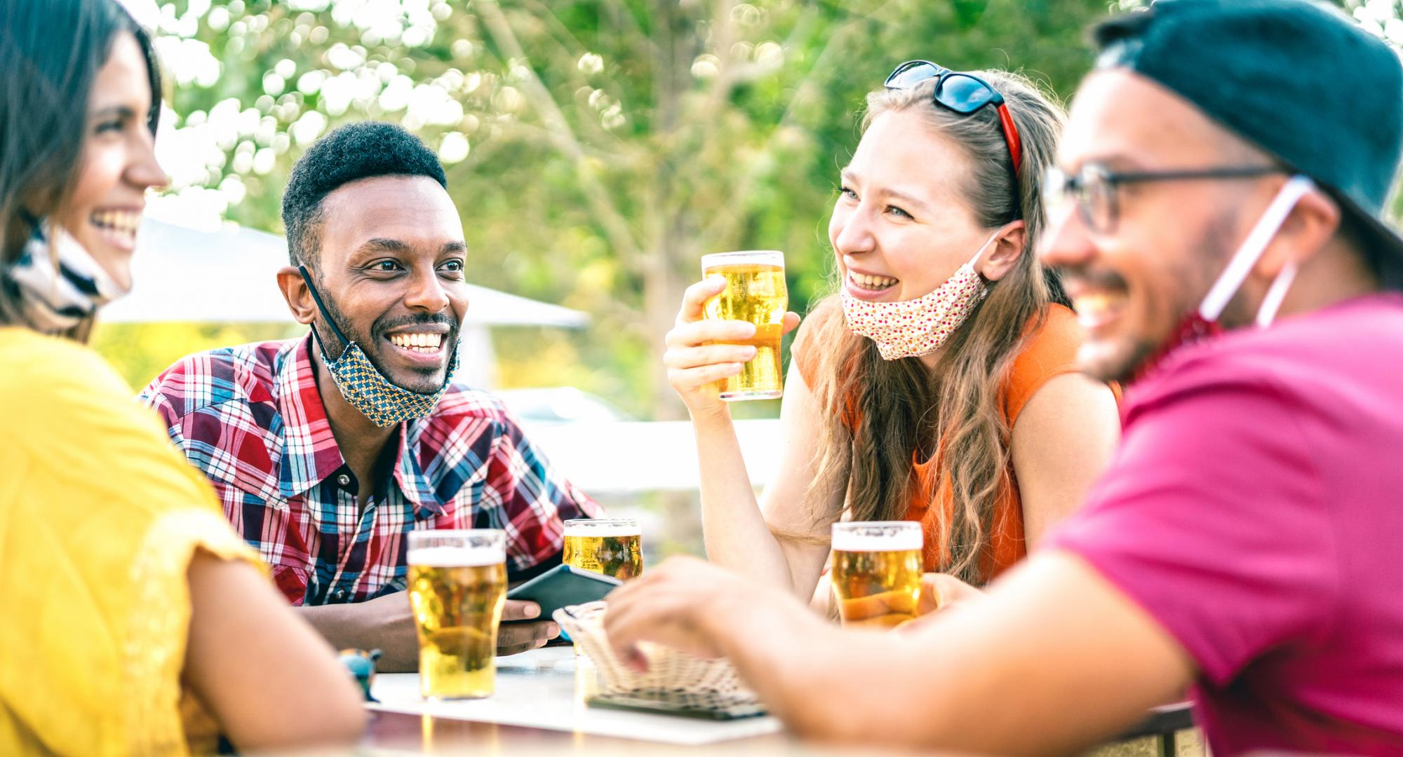 Friends laugh at dinner table