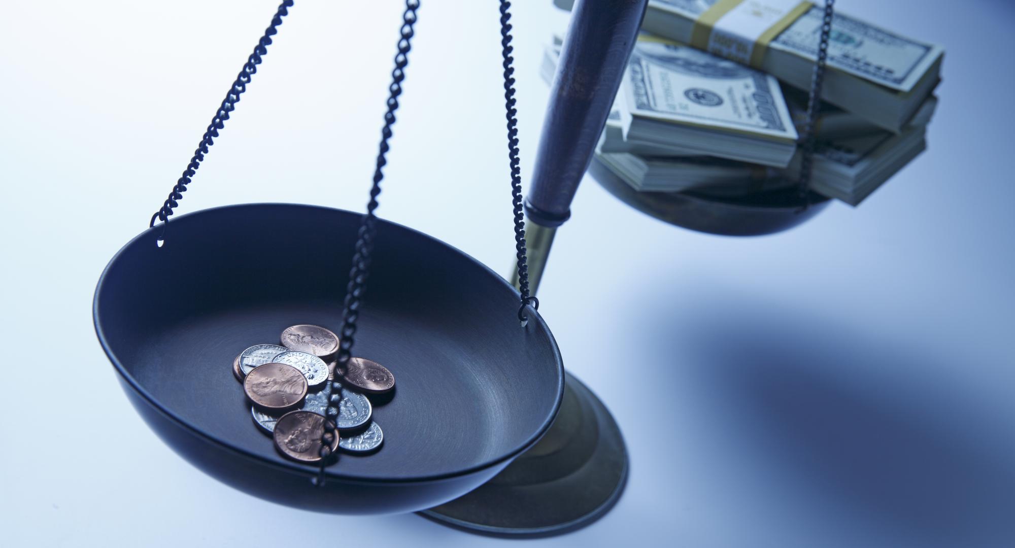 Scales show pennies compared to dollars
