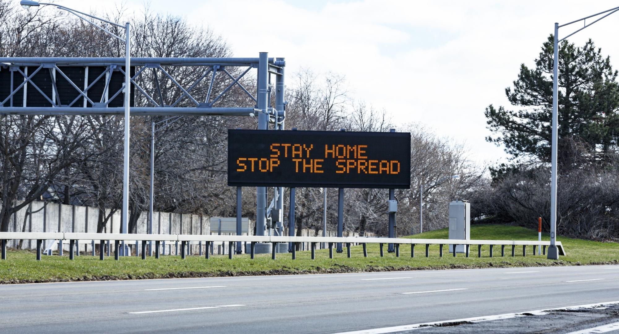 Stay home save lives sign
