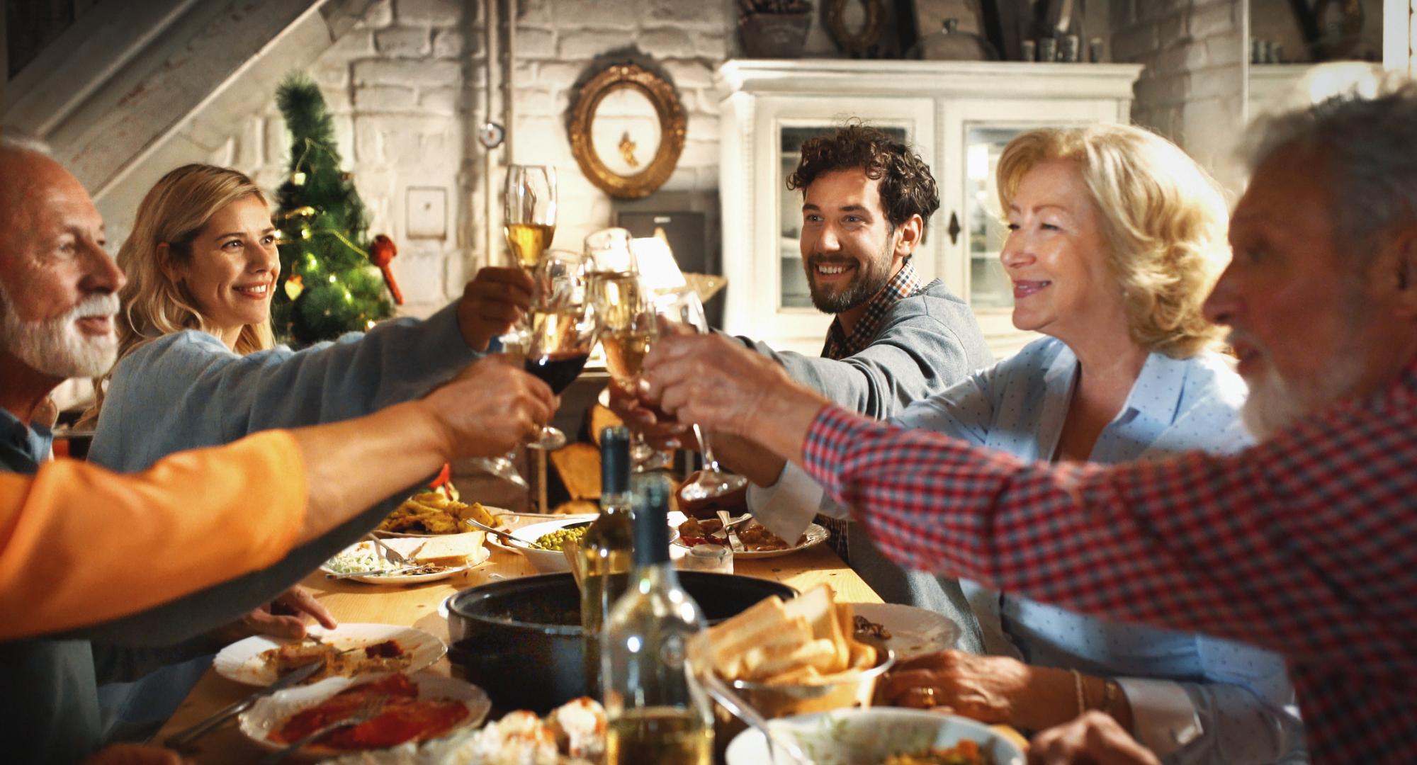 Family gathered around a dinner table at Christmas