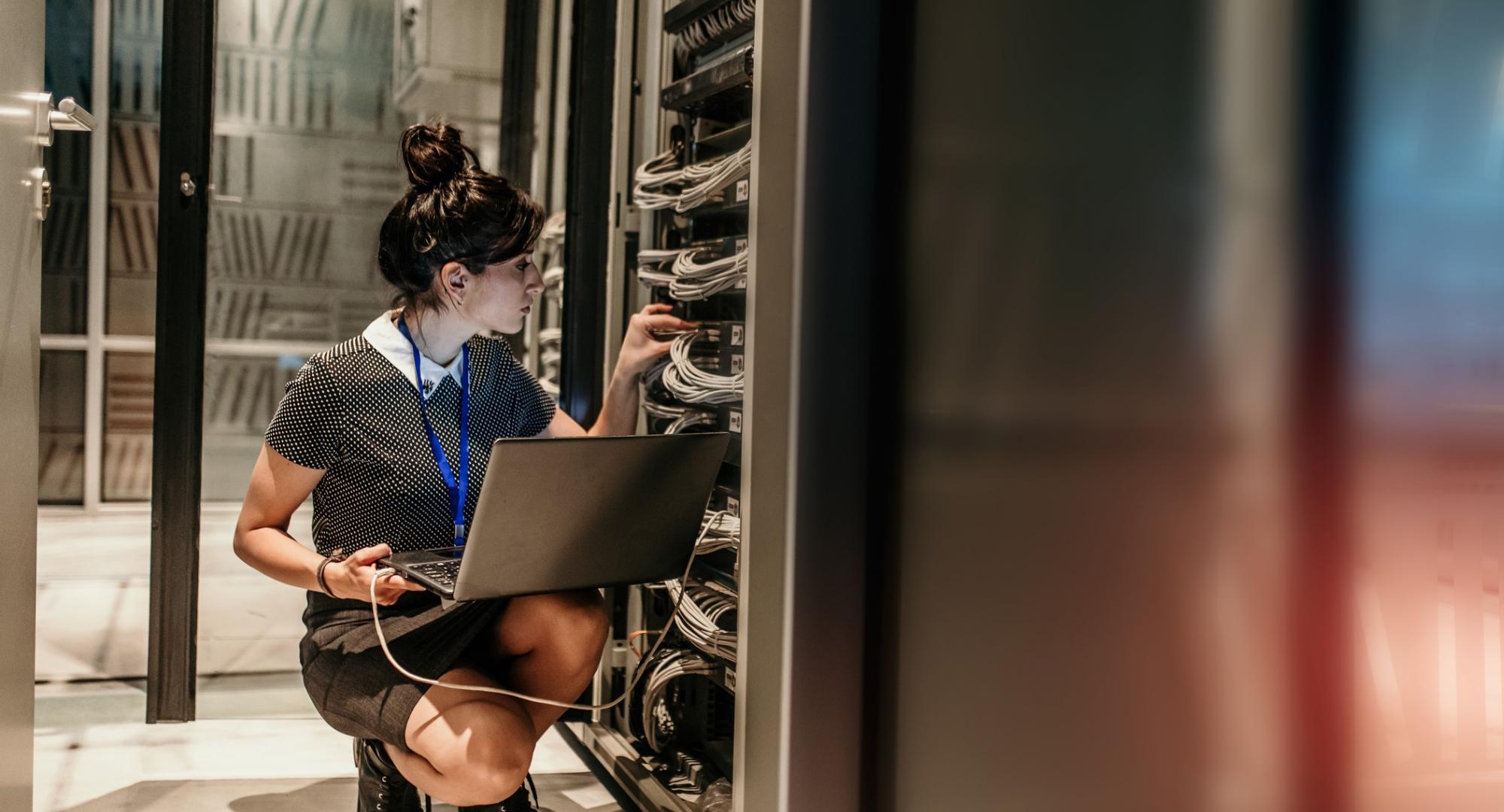 Technician in server room updating firmware.