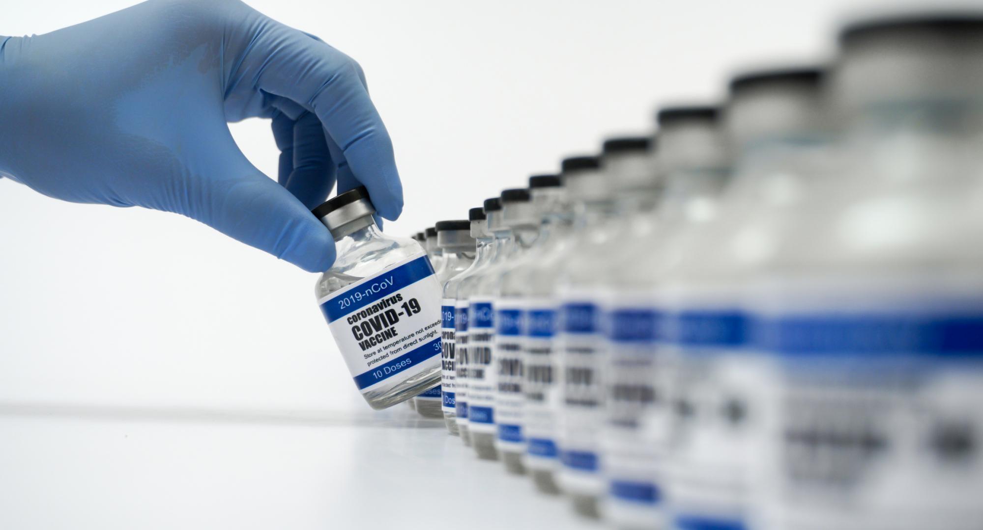 Covid 19 vaccine stands in a line. 