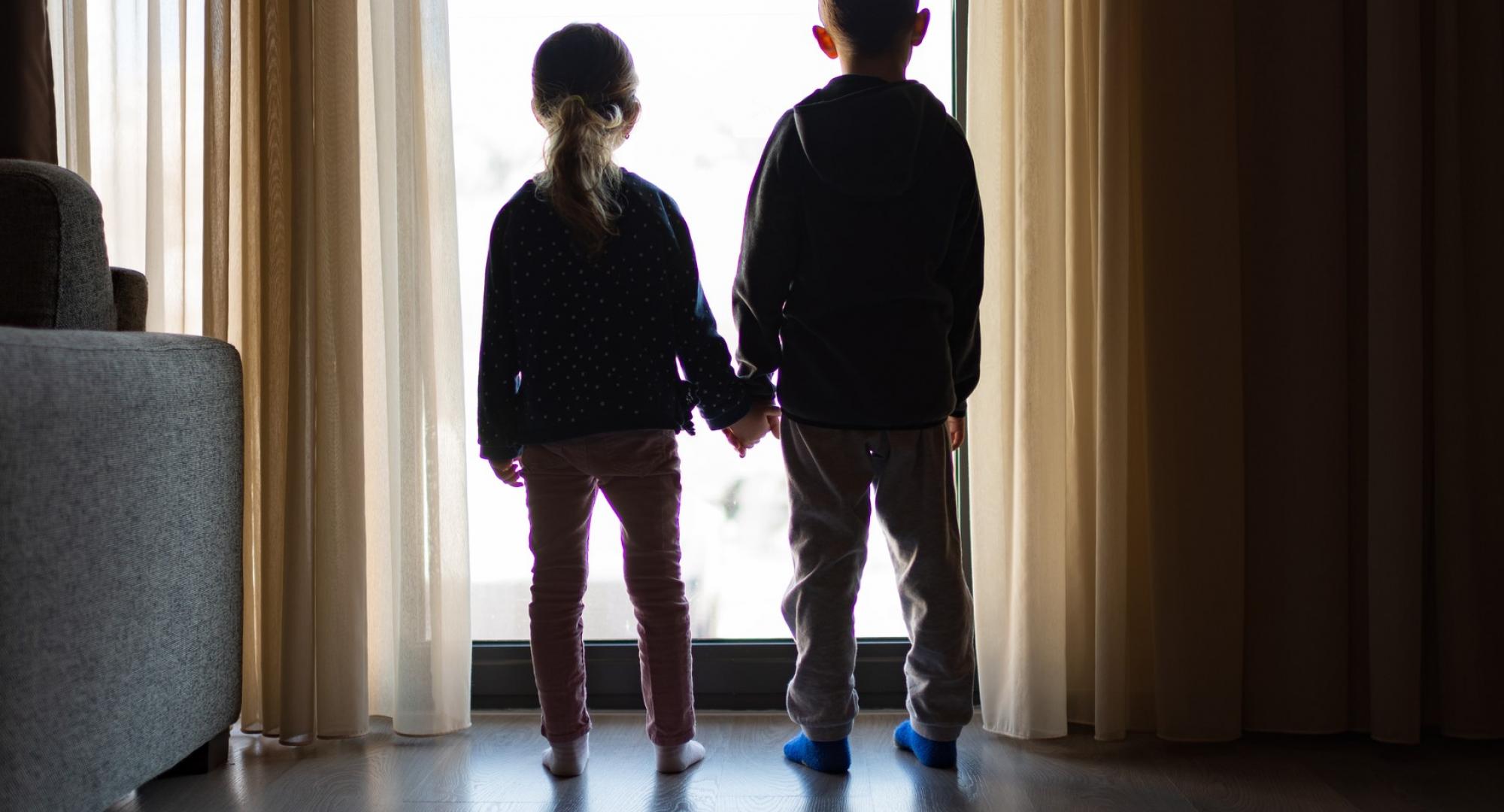 Children looking out the window 