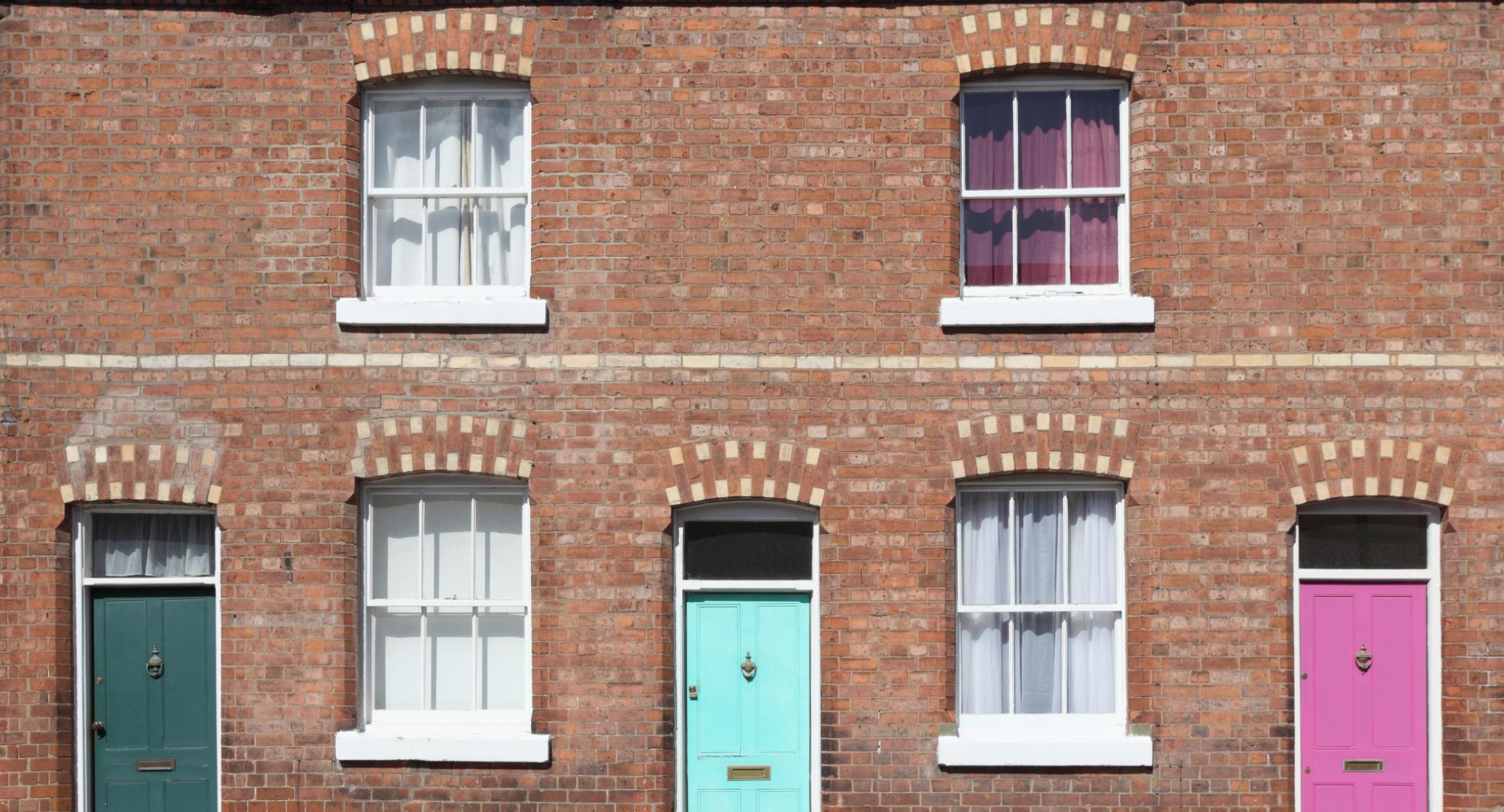 Terraced houses with multicoloured doors. 