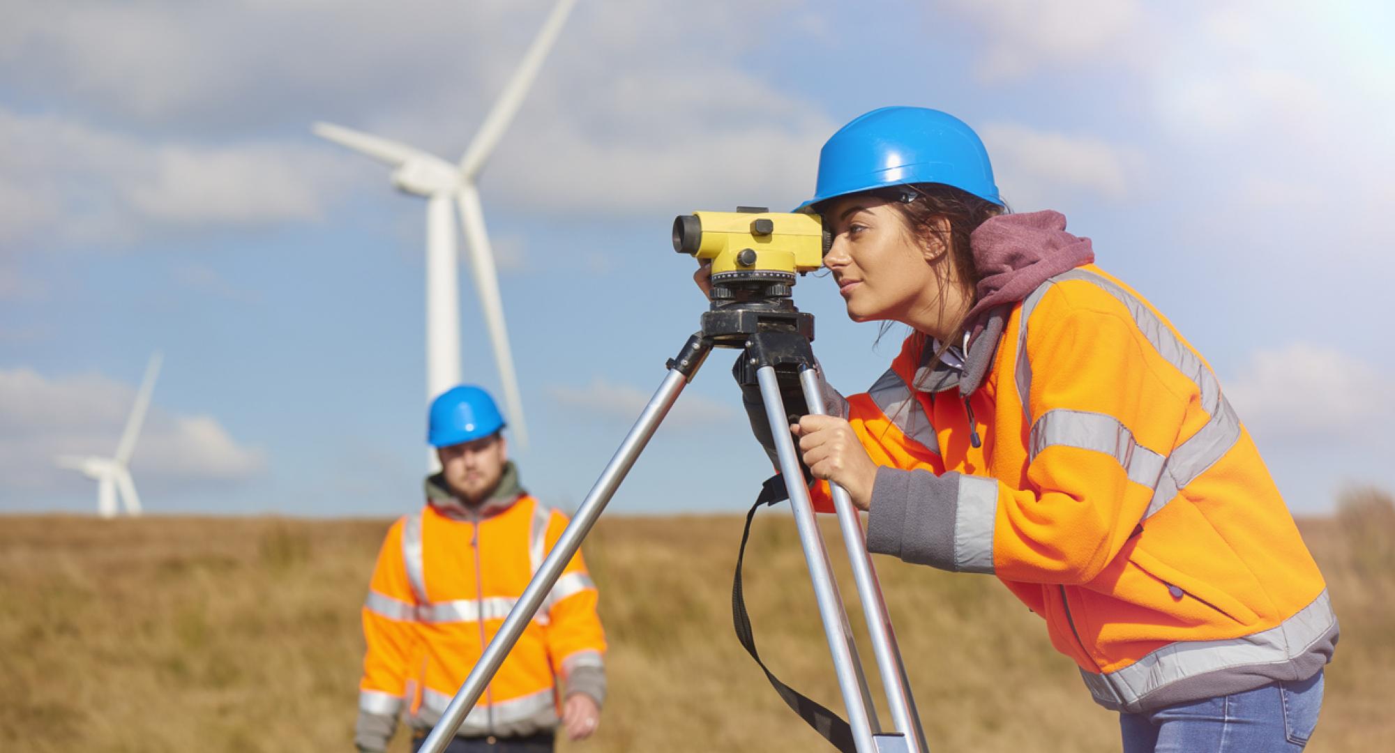 Engineers use surveying tools. 