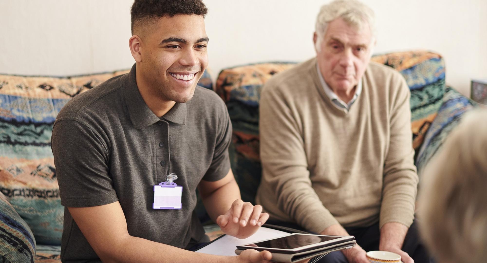 Social care worker talking with a family