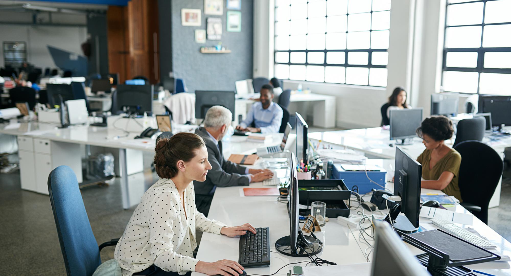 Office workers in an open plan space