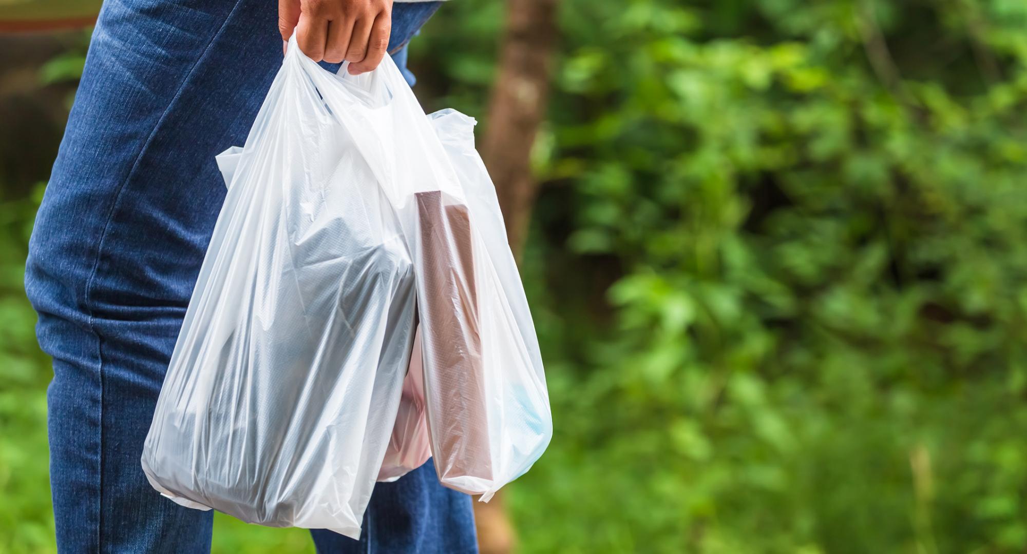 Woman holding plastic bags