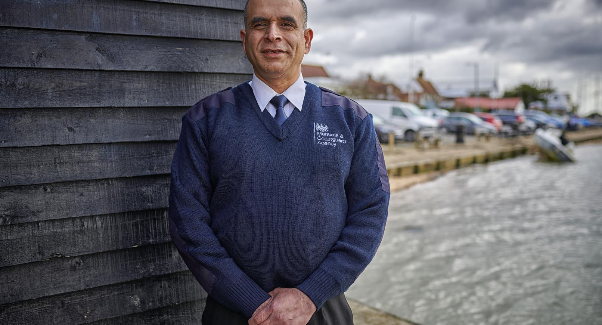 Public service worker stood on a dock