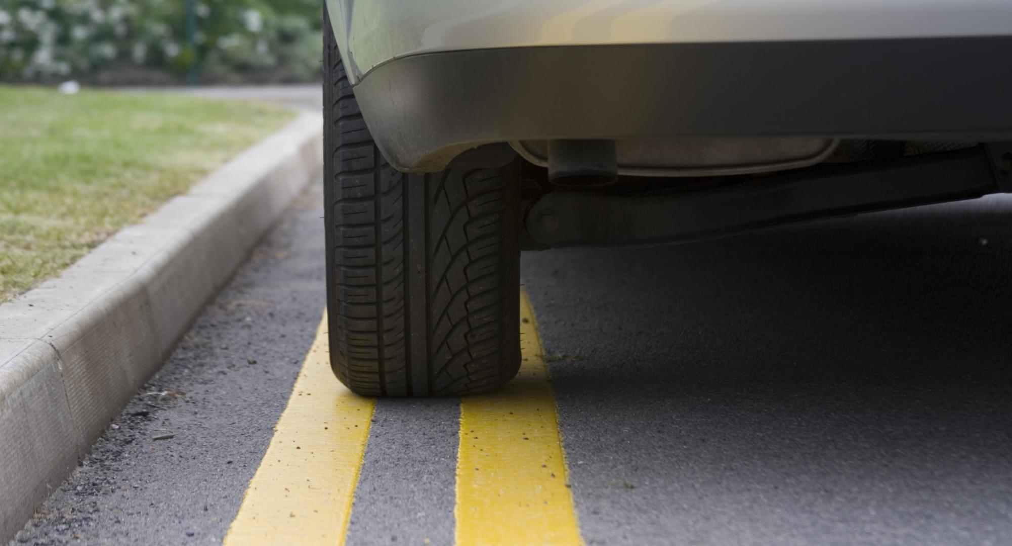 Car parked on yellow lines